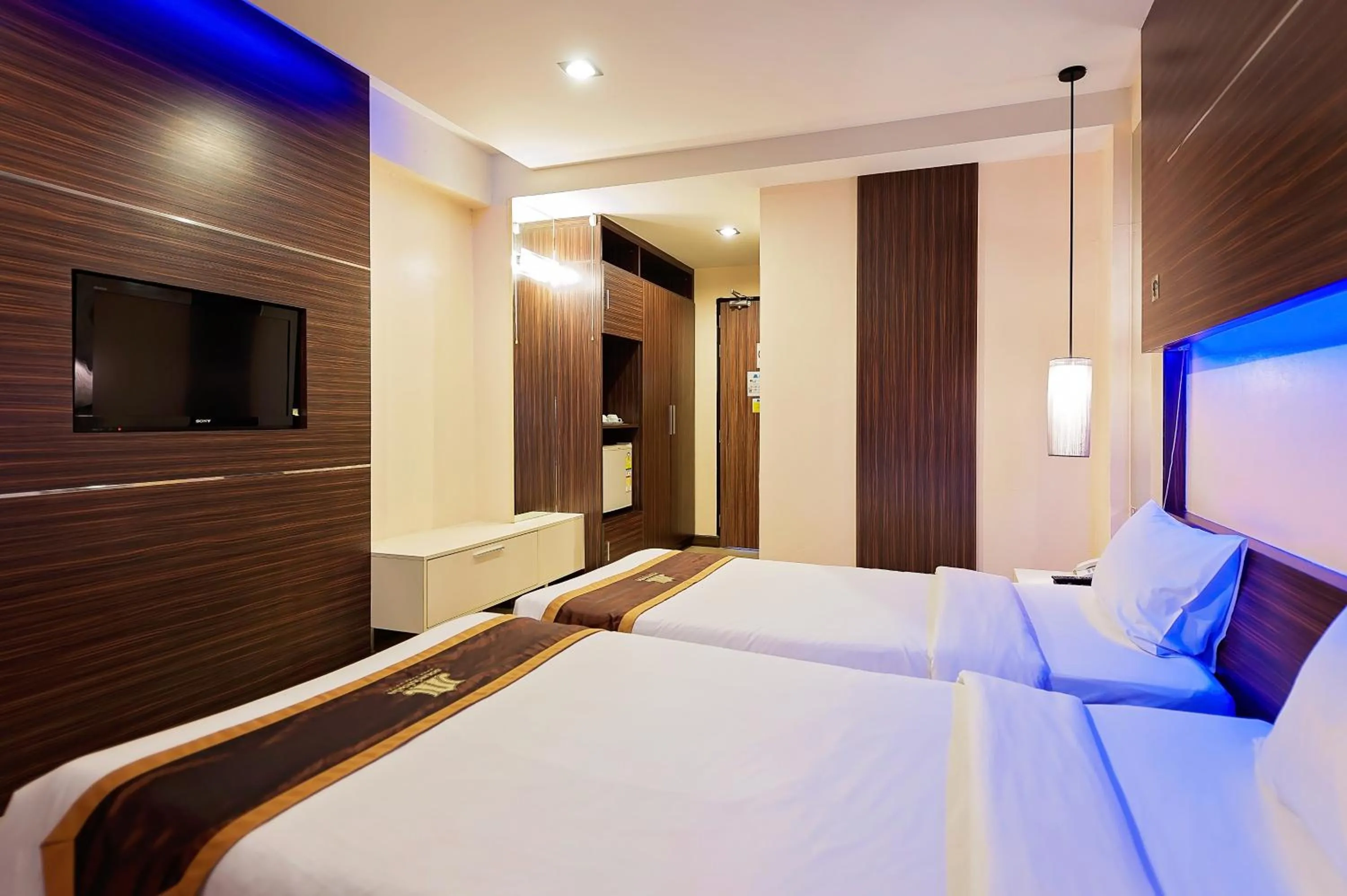 Bed in Khon Kaen Hotel