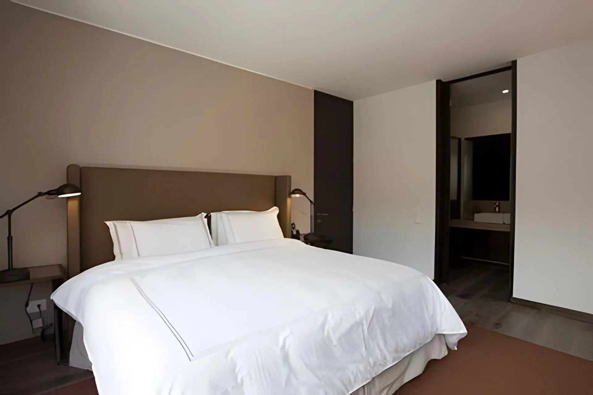 Bed in Attik Luxury Apts