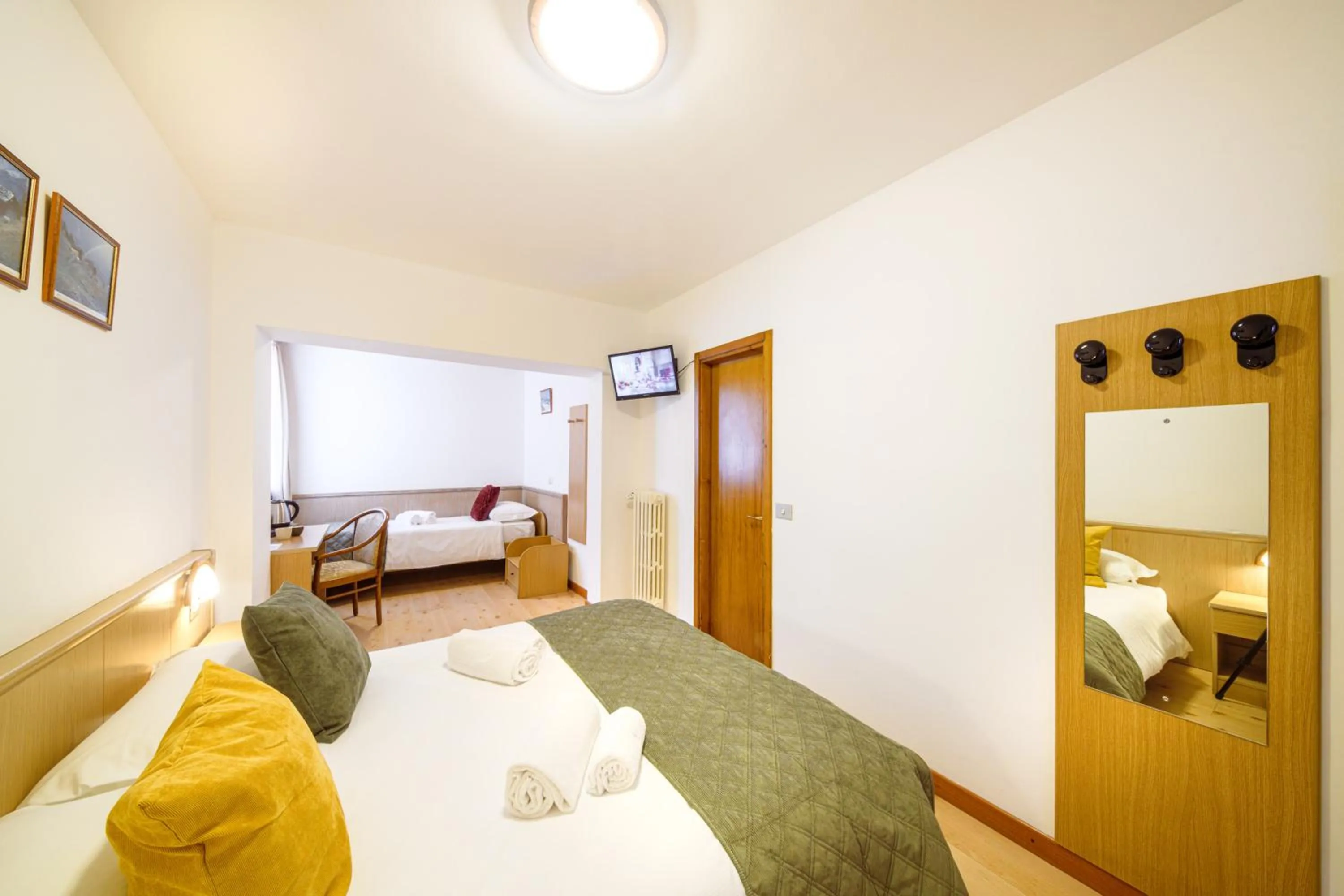 Bed in Hotel Ambassador Bormio