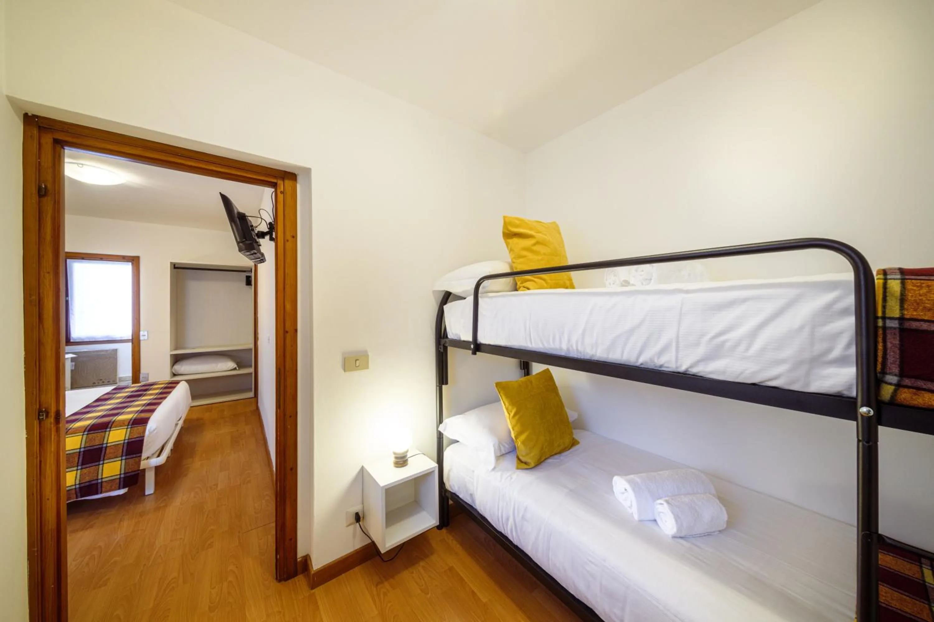 Bed in Hotel Ambassador Bormio