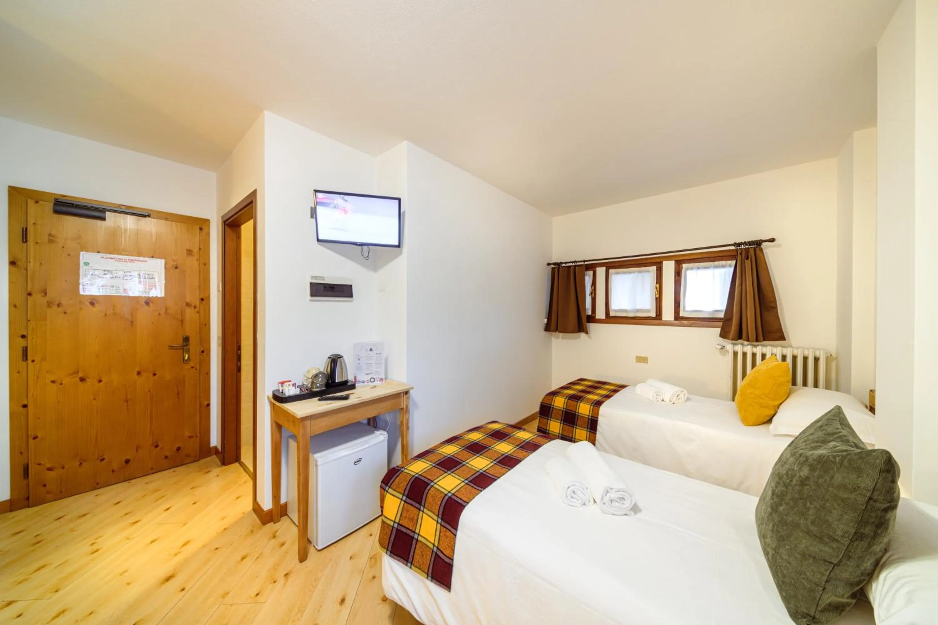 Bed in Hotel Ambassador Bormio