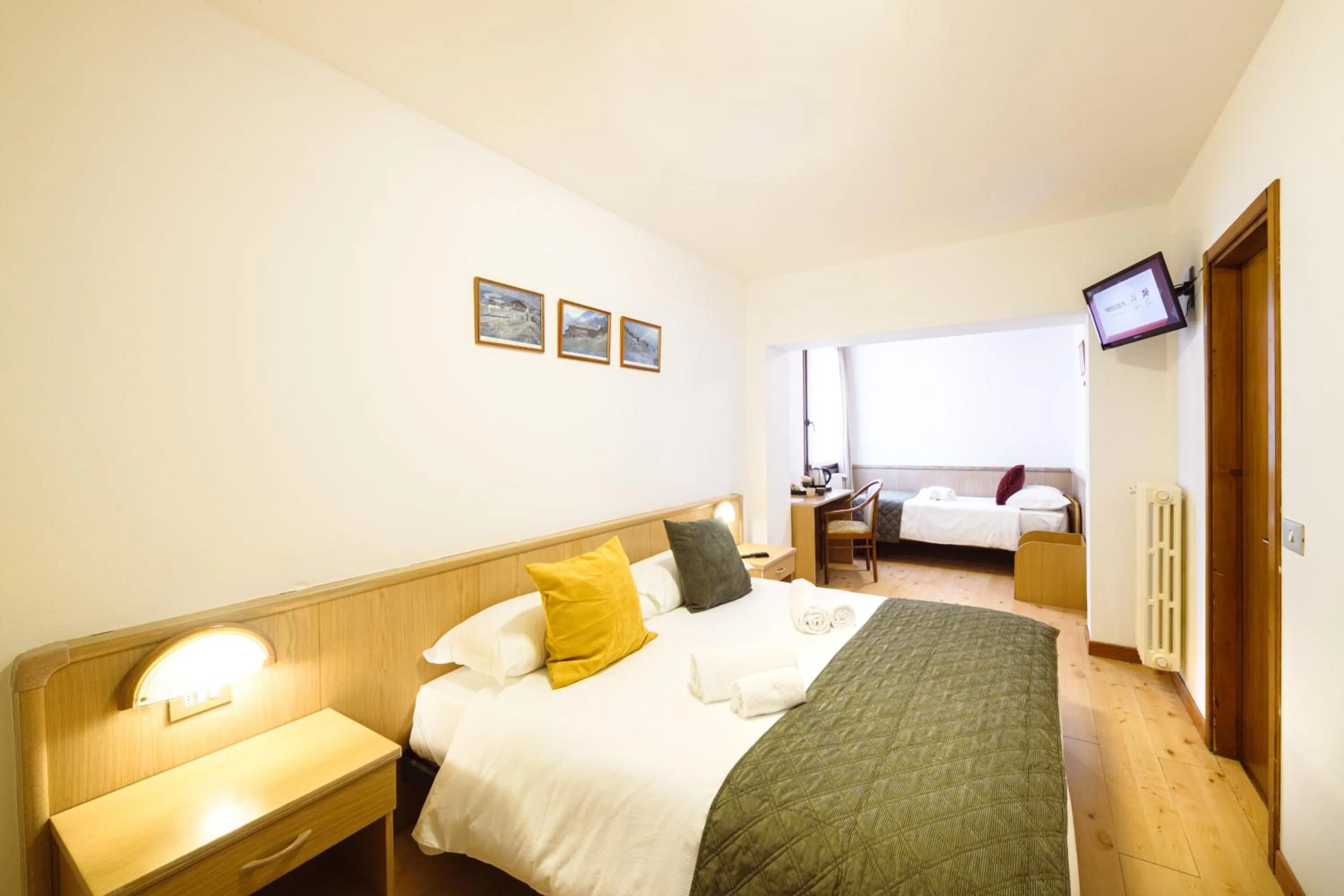 Bed in Hotel Ambassador Bormio