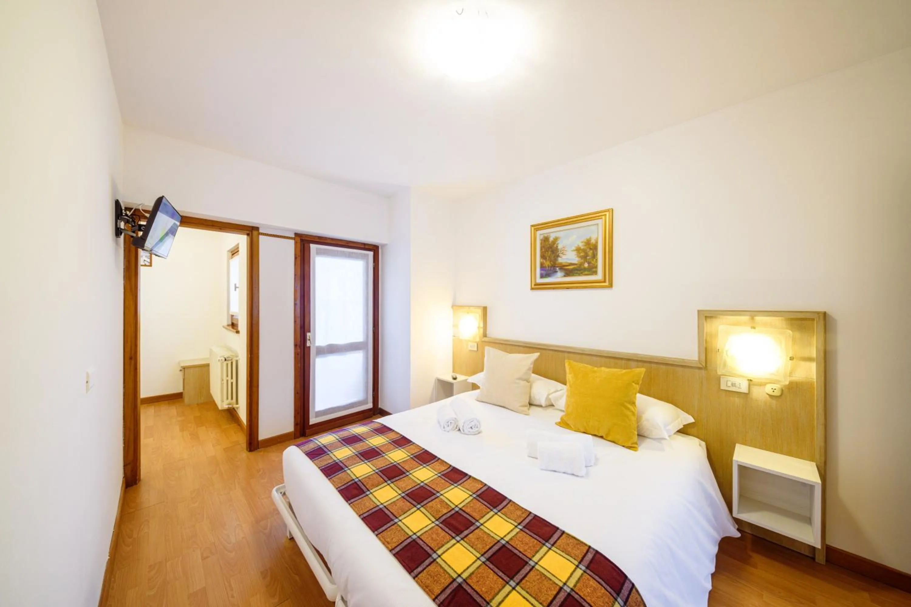 Bed in Hotel Ambassador Bormio