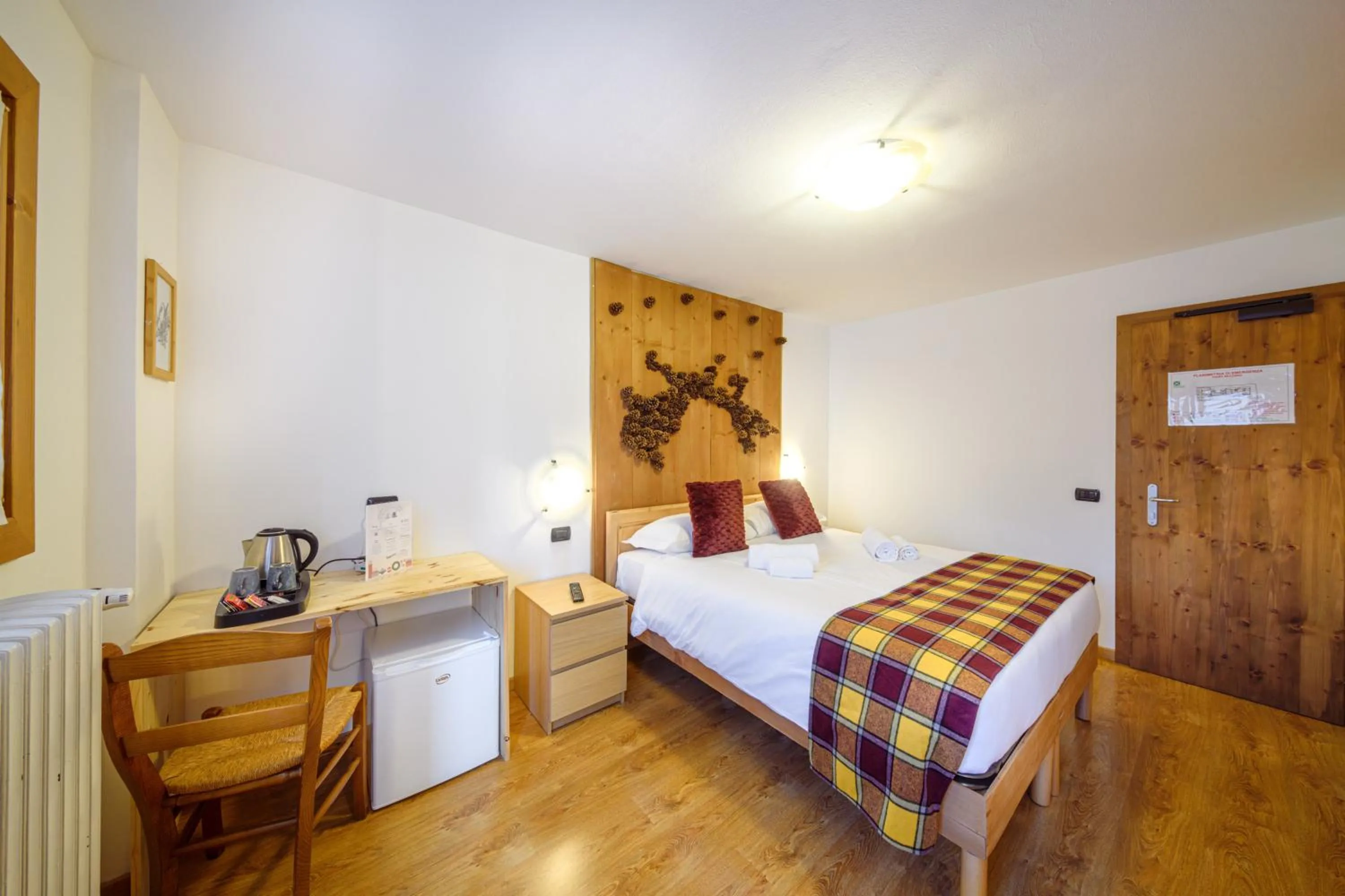 Bed in Hotel Ambassador Bormio