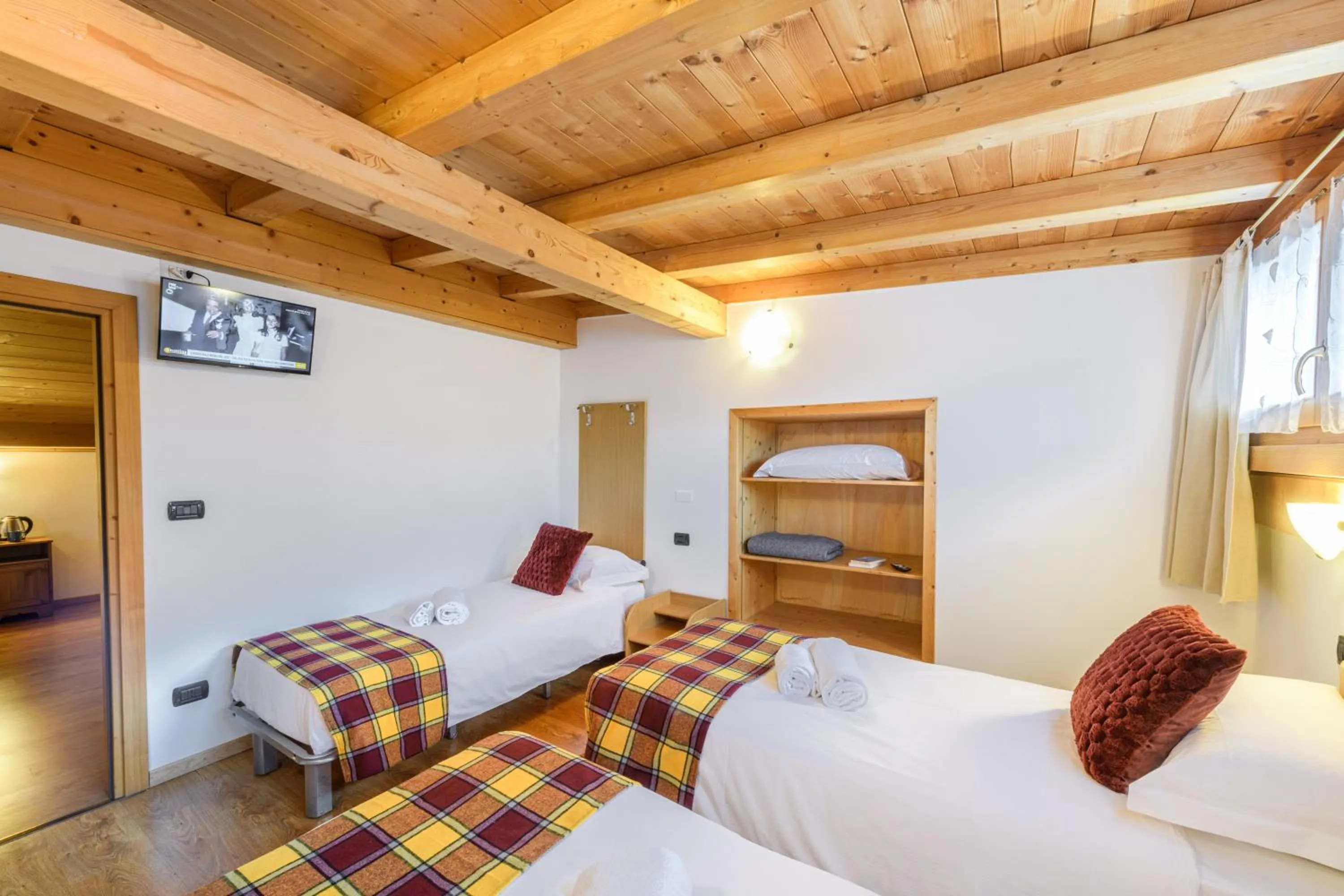 Bed in Hotel Ambassador Bormio
