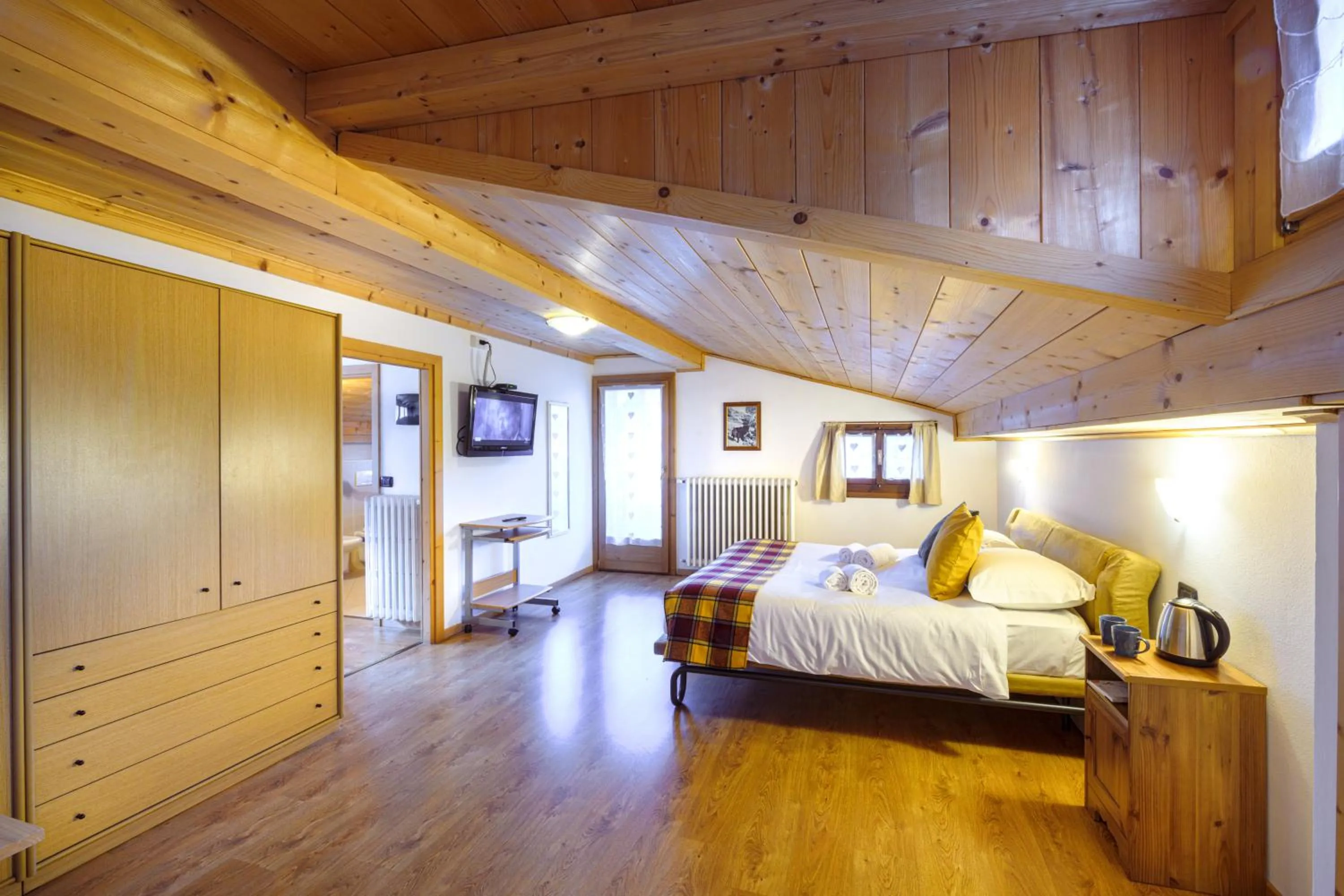 Bed in Hotel Ambassador Bormio
