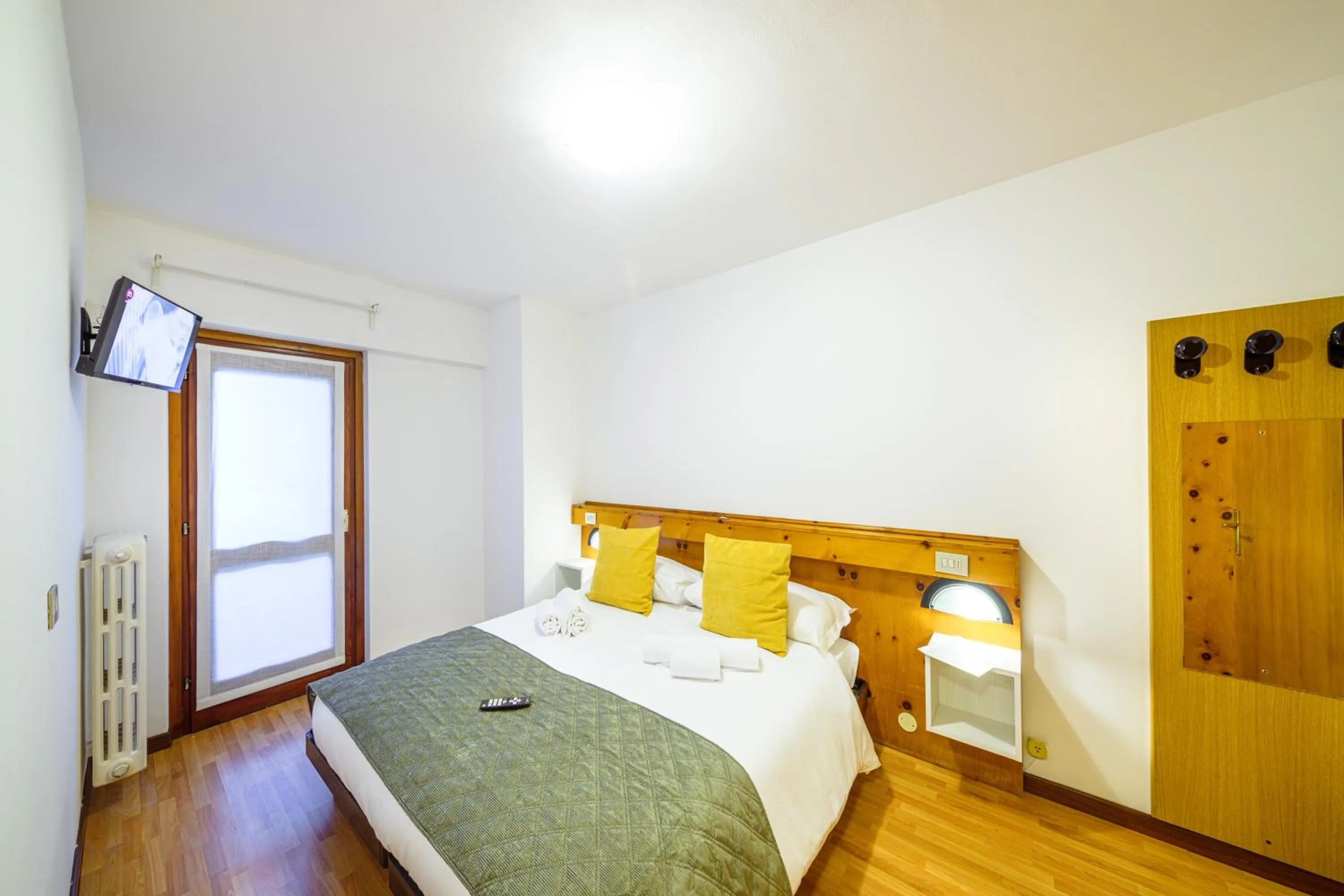 Bed in Hotel Ambassador Bormio