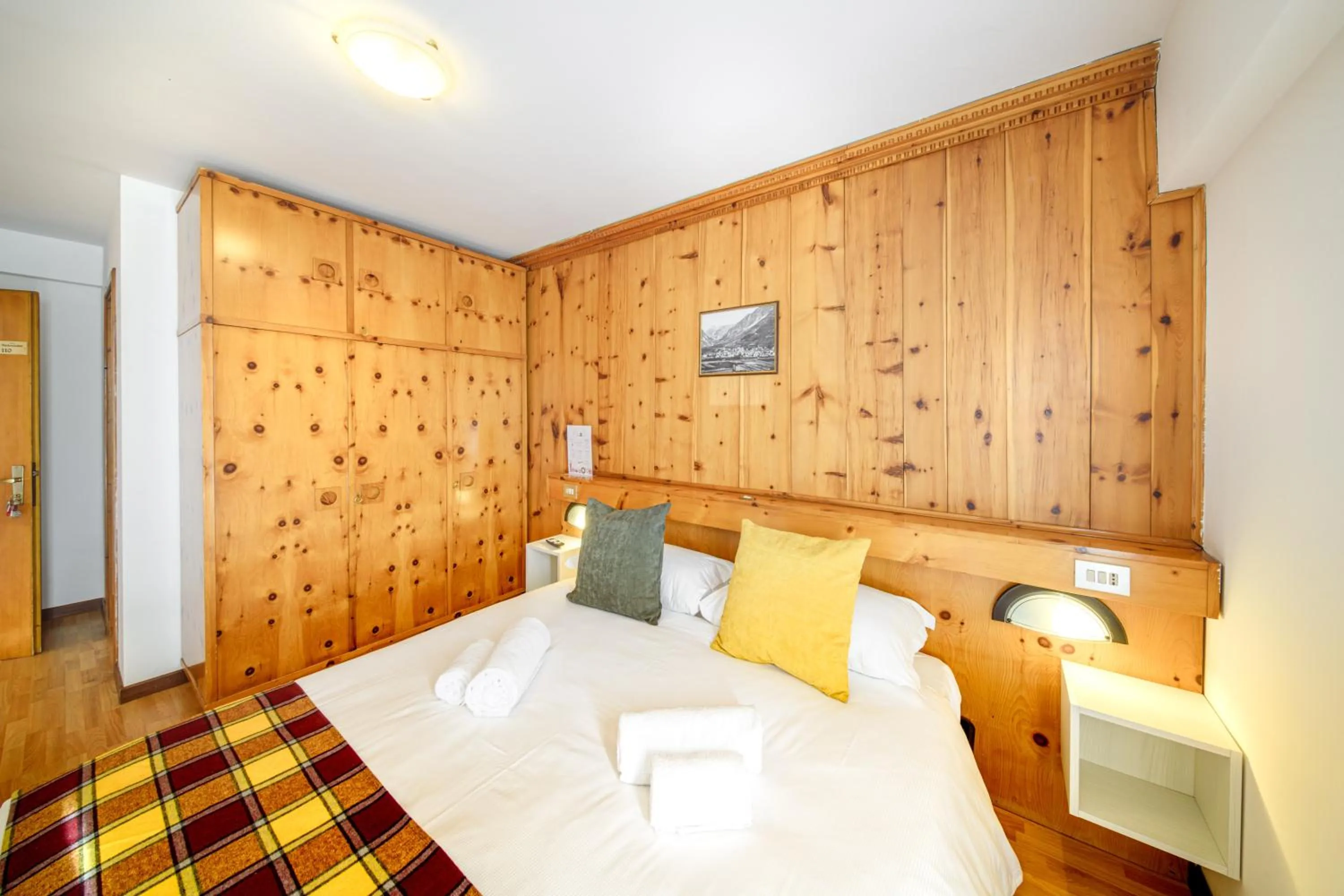 Bed in Hotel Ambassador Bormio