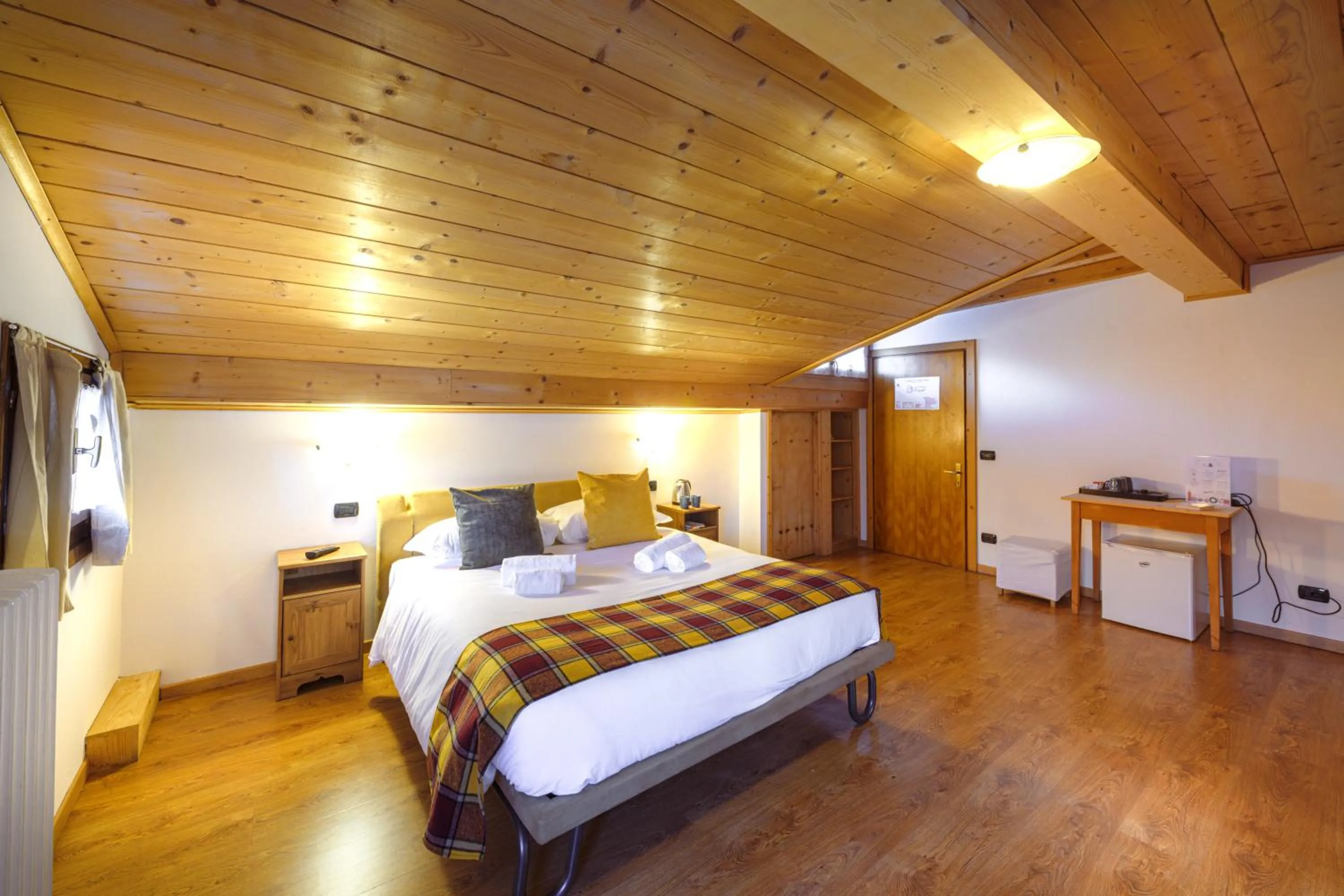 Bed in Hotel Ambassador Bormio