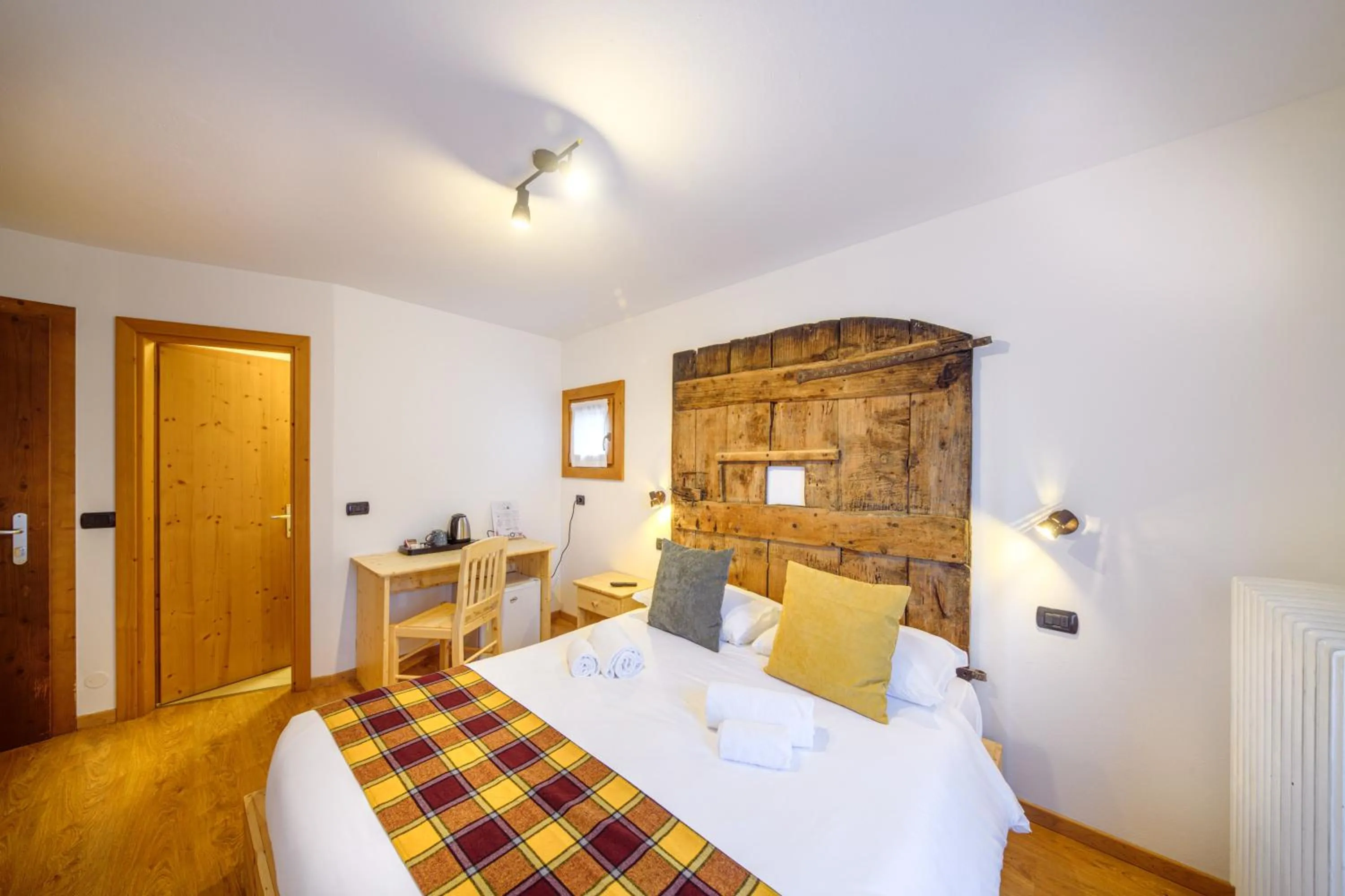Bed in Hotel Ambassador Bormio