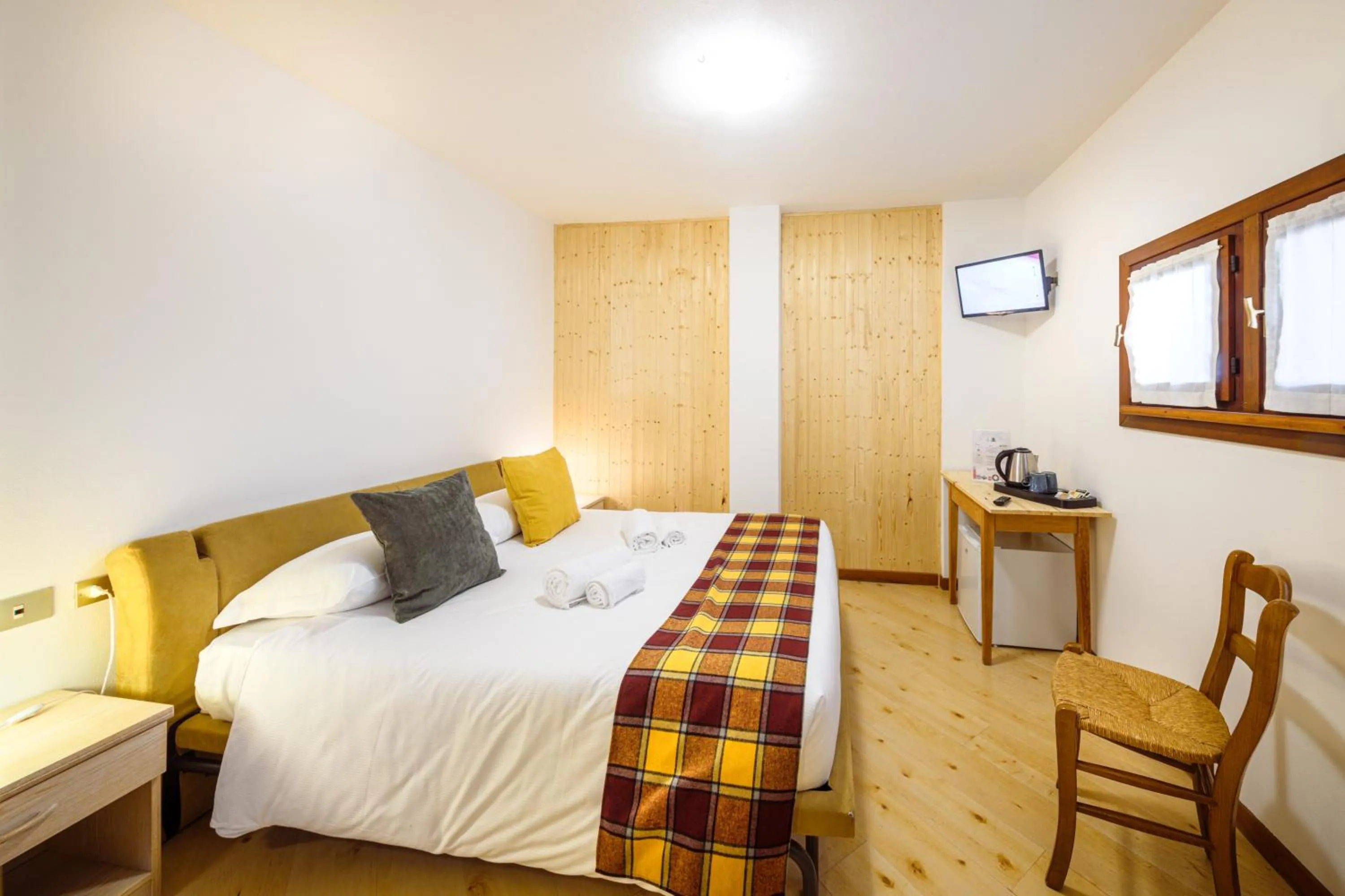 Bed in Hotel Ambassador Bormio