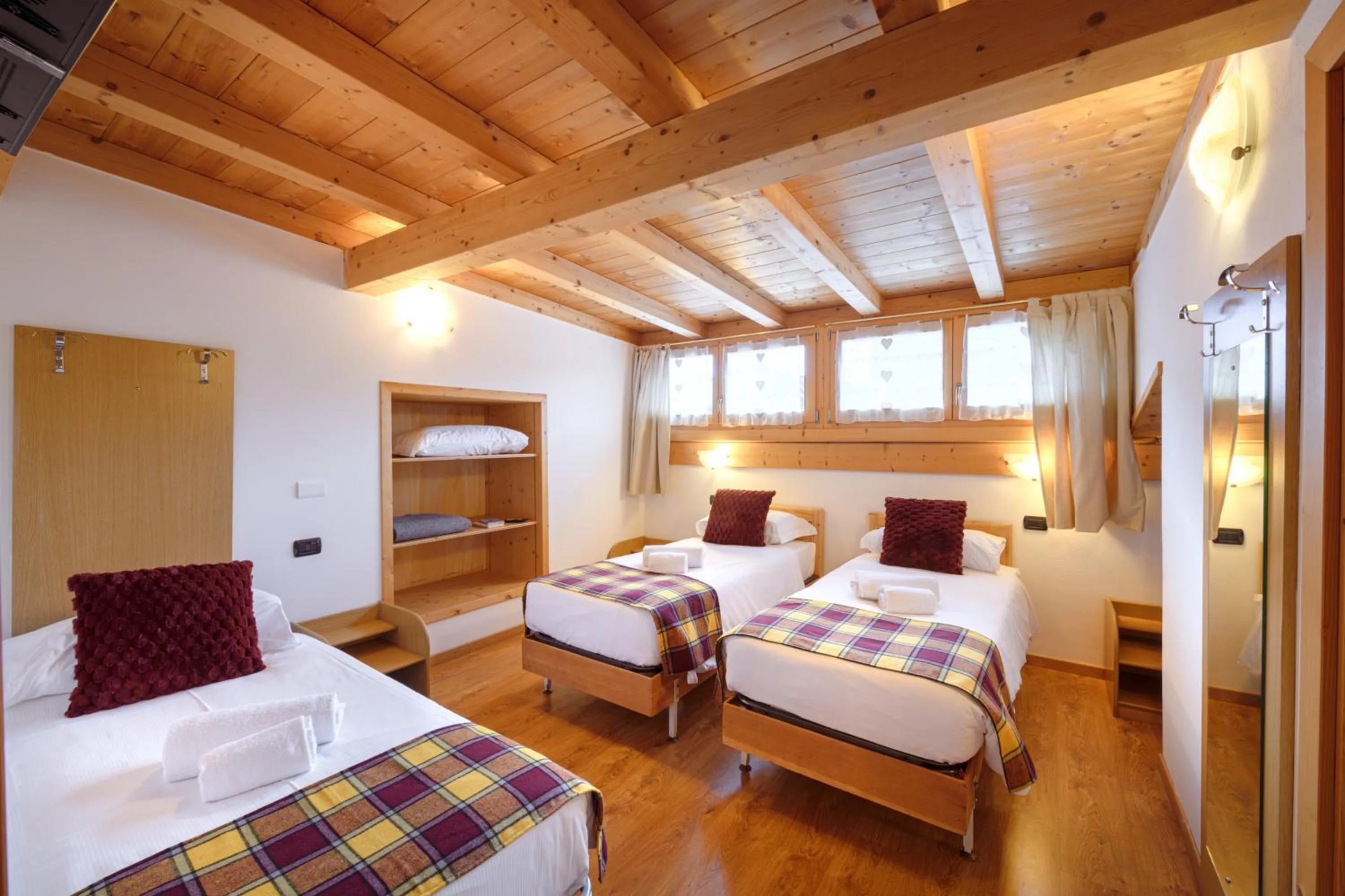 Bed in Hotel Ambassador Bormio