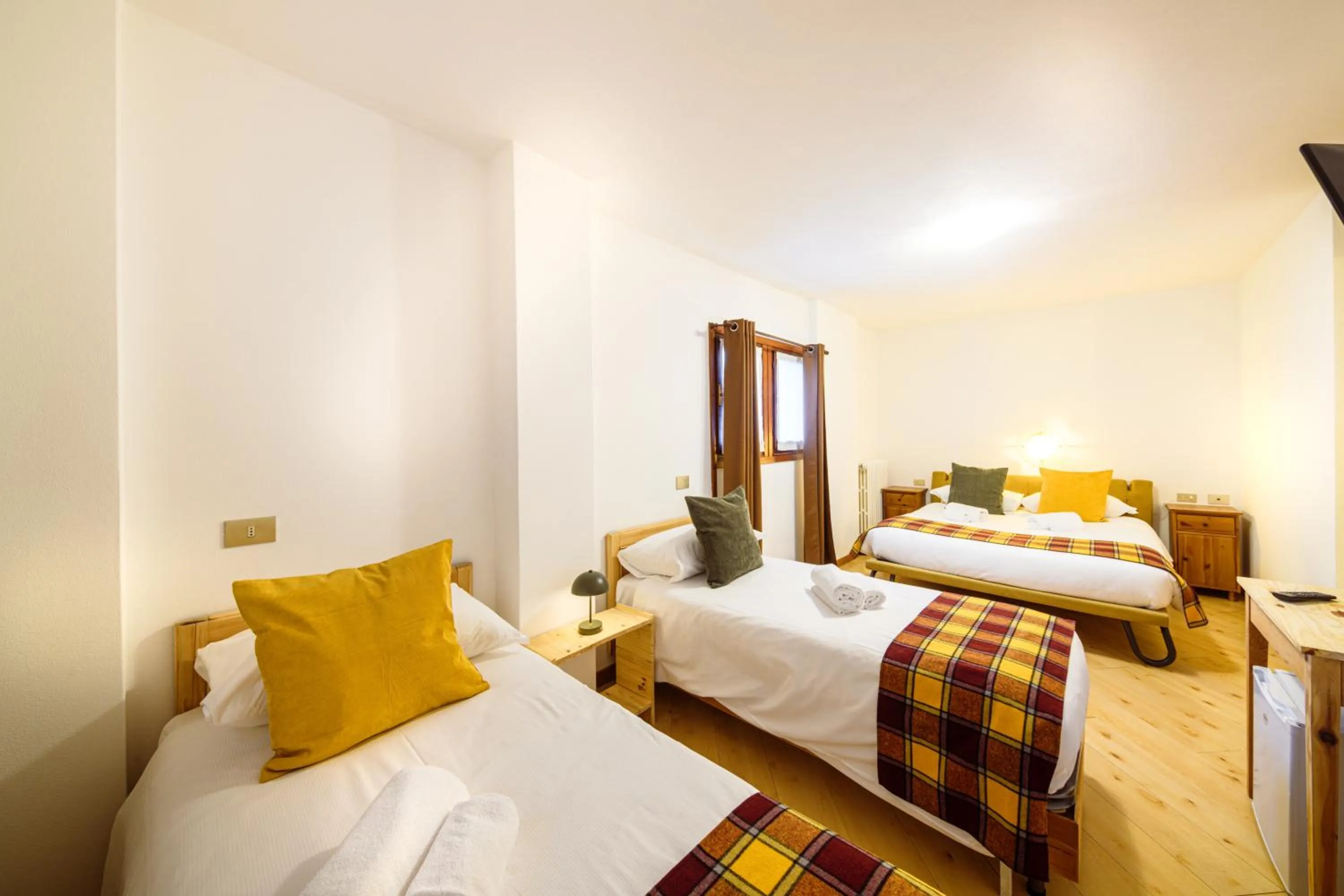 Bed in Hotel Ambassador Bormio