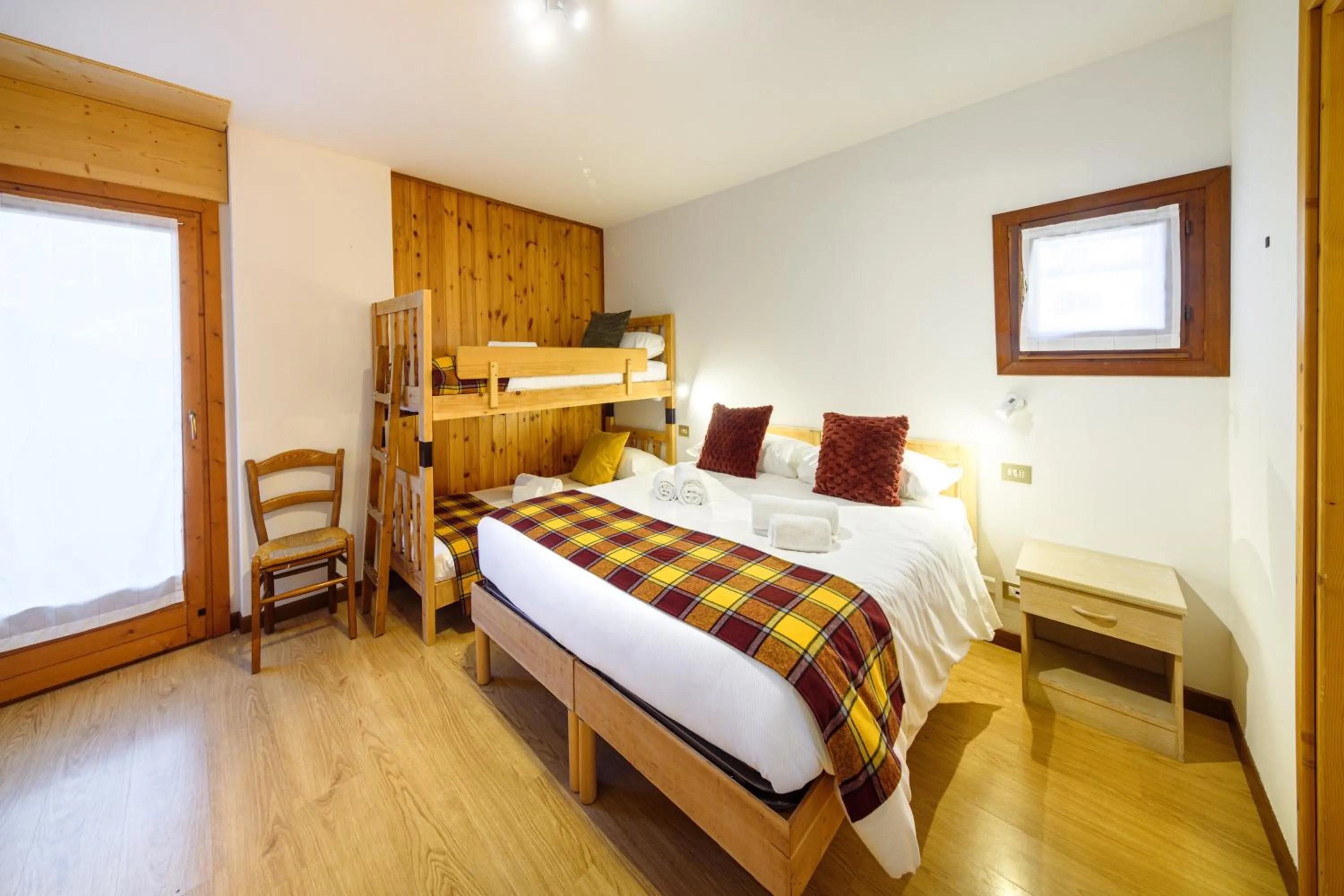 Bed in Hotel Ambassador Bormio