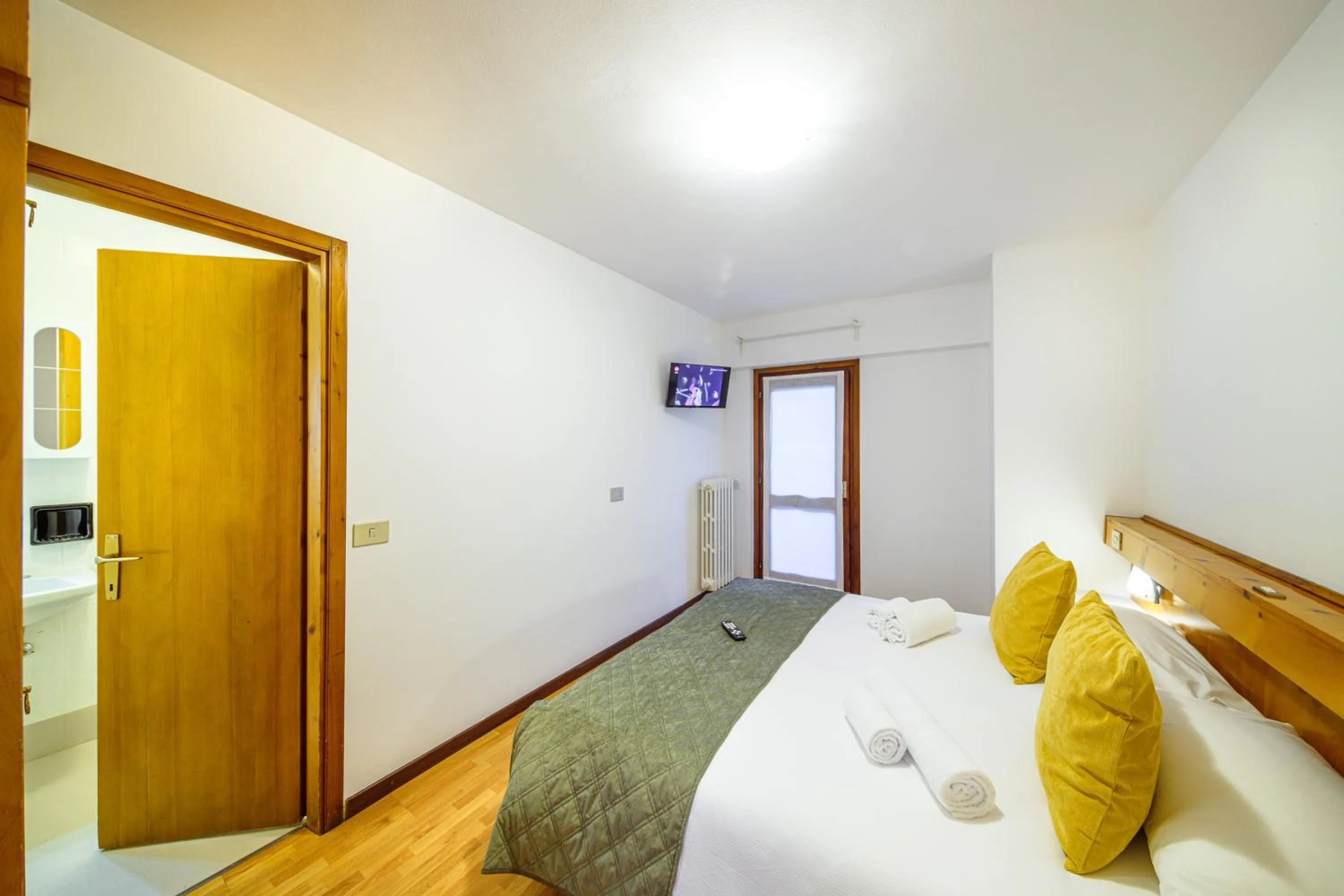 Bed in Hotel Ambassador Bormio
