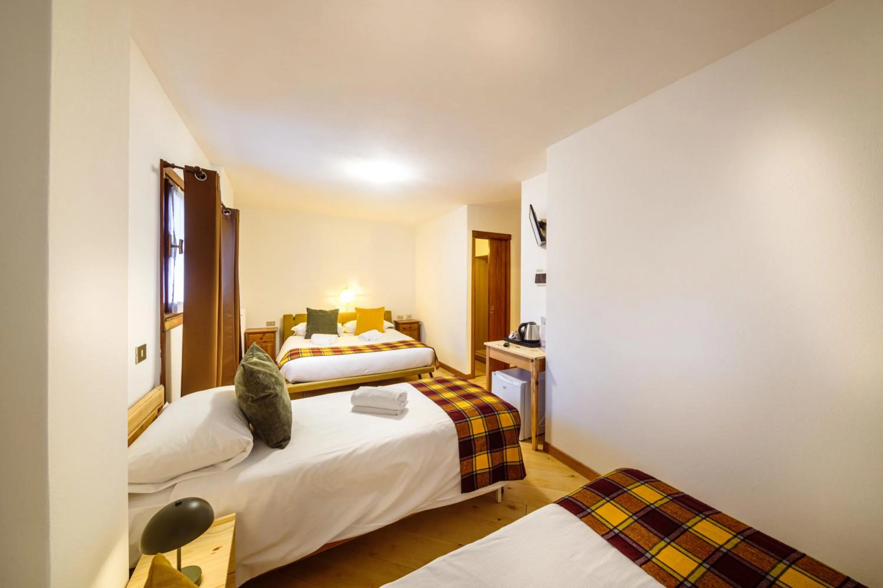 Bed in Hotel Ambassador Bormio