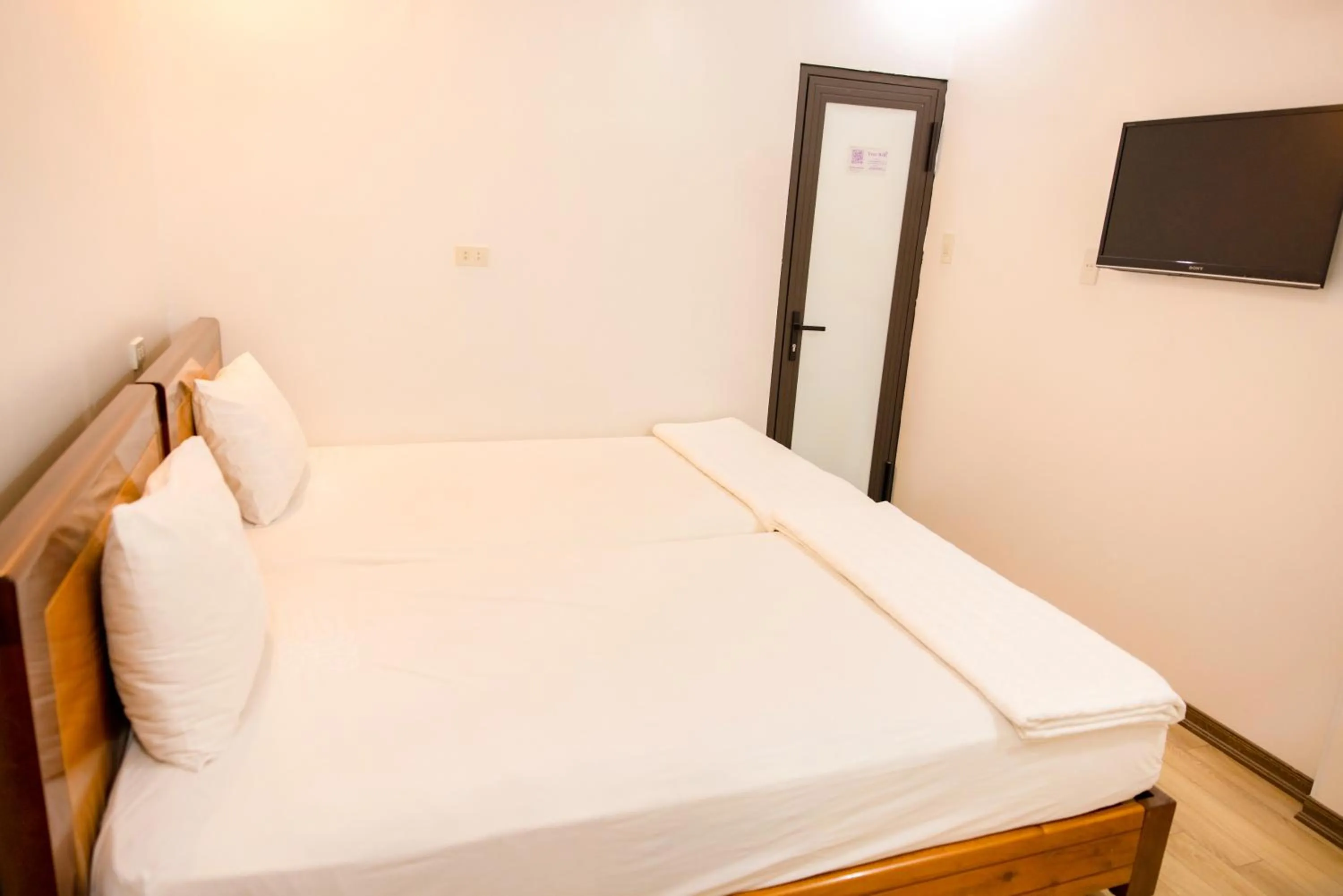 Bed in Ngoc Anh Legend Hotel