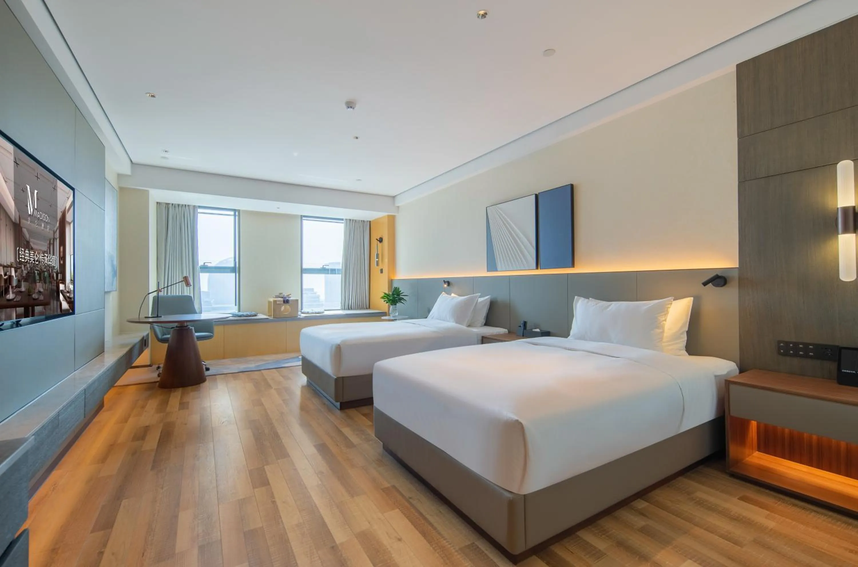 Bed in Madison Hotel Qingdao West Coast City Balcony