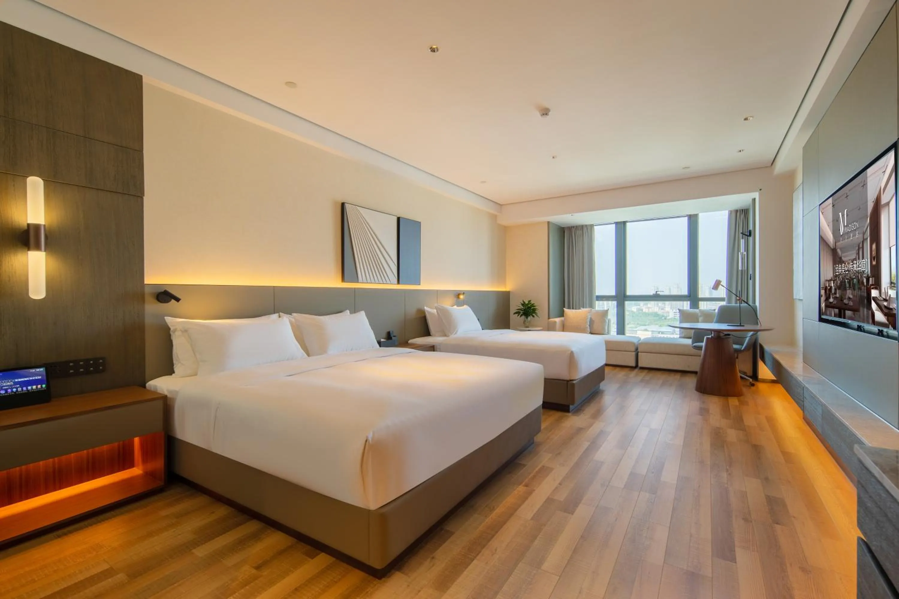 Bed in Madison Hotel Qingdao West Coast City Balcony