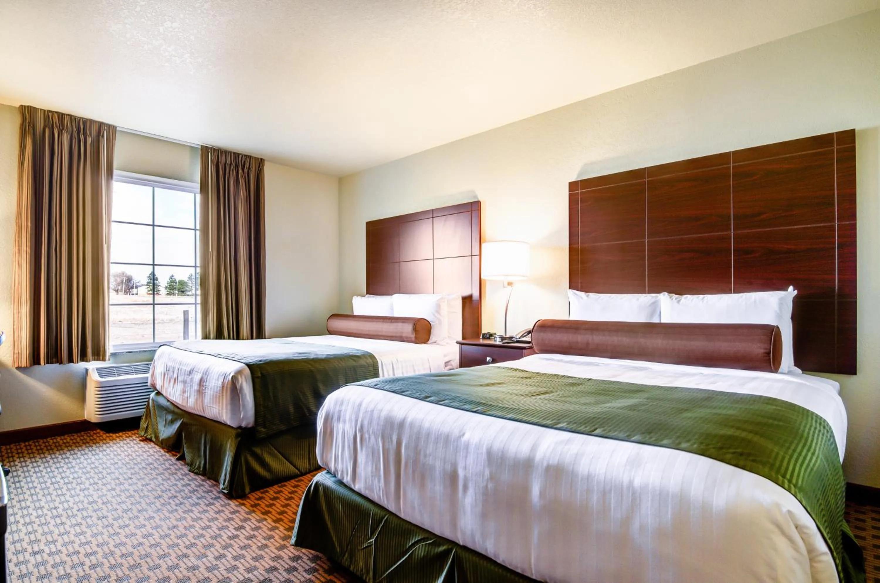 Bed in Castle Rock Inn & Suites - Quinter