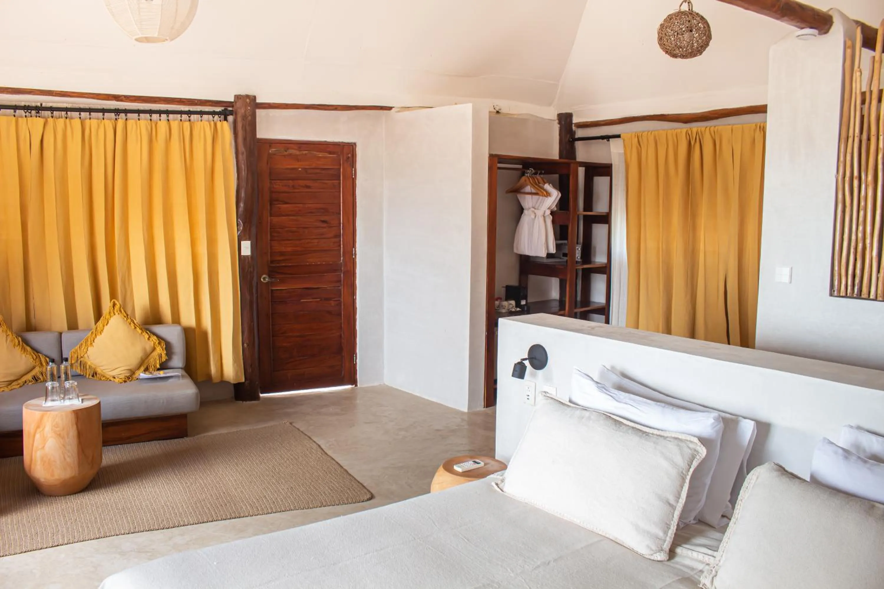 Bed in Dune Boutique Hotel located at the party zone