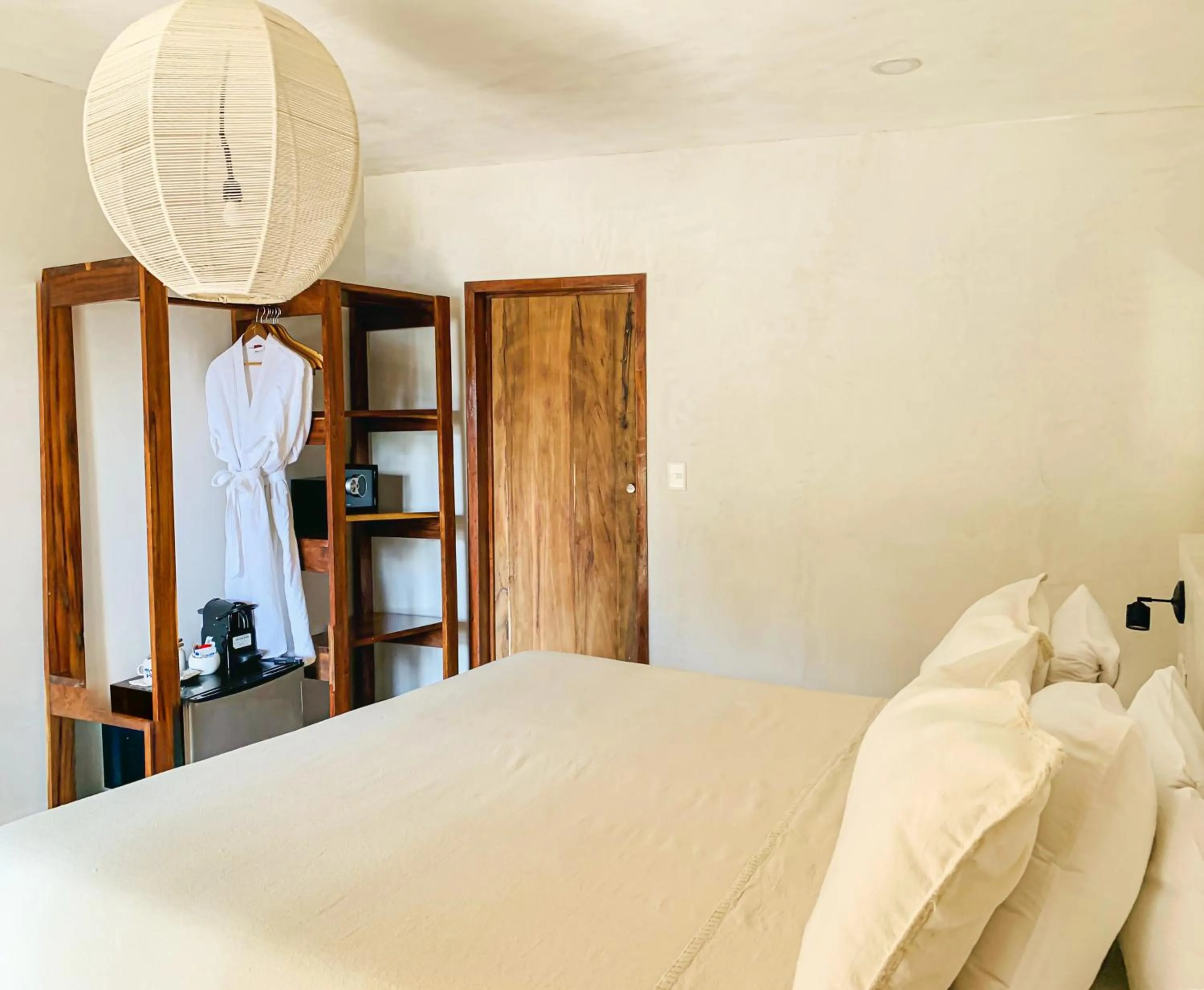 Bed in Dune Boutique Hotel located at the party zone