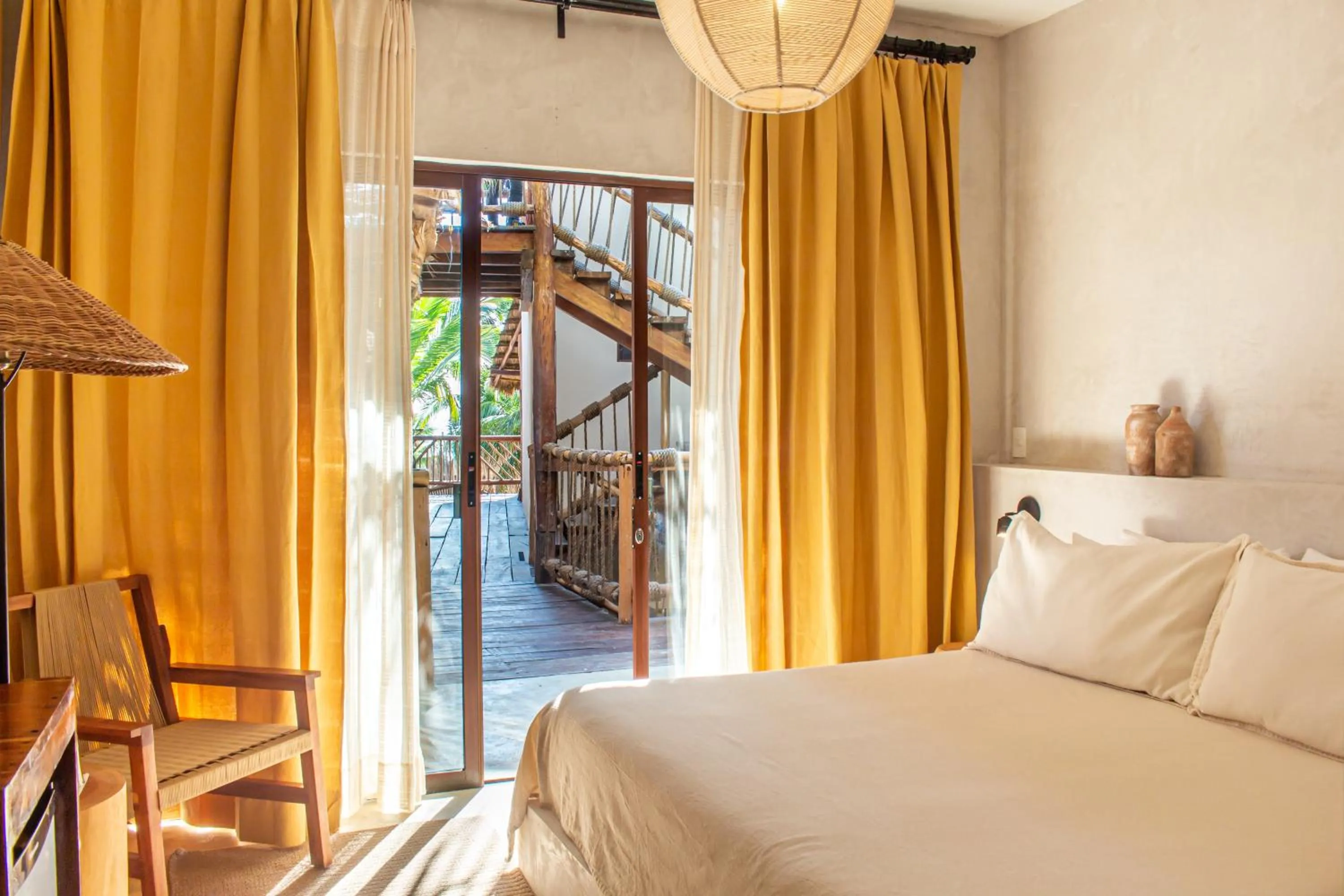 Bed in Dune Boutique Hotel located at the party zone