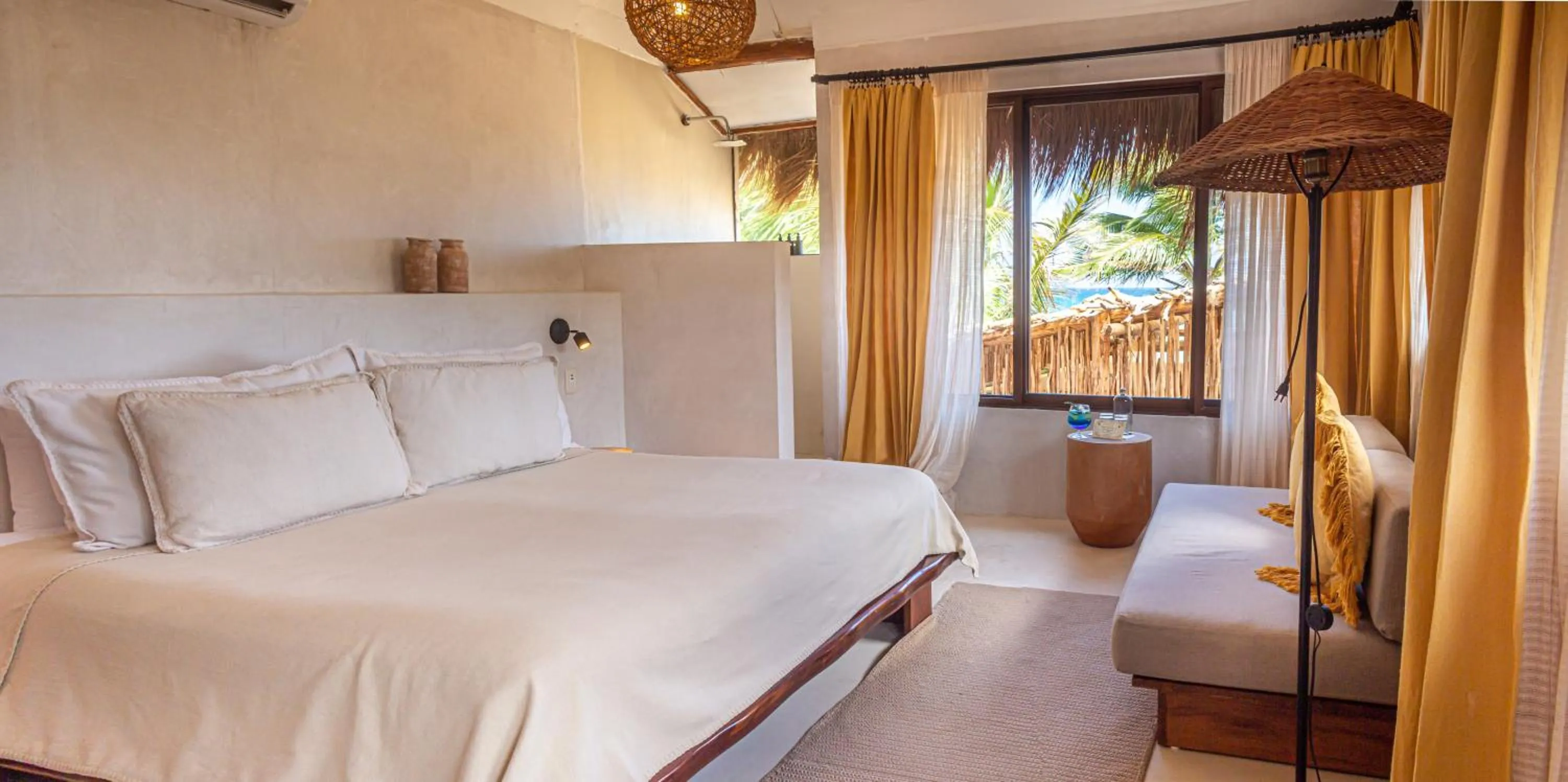 Bed in Dune Boutique Hotel located at the party zone