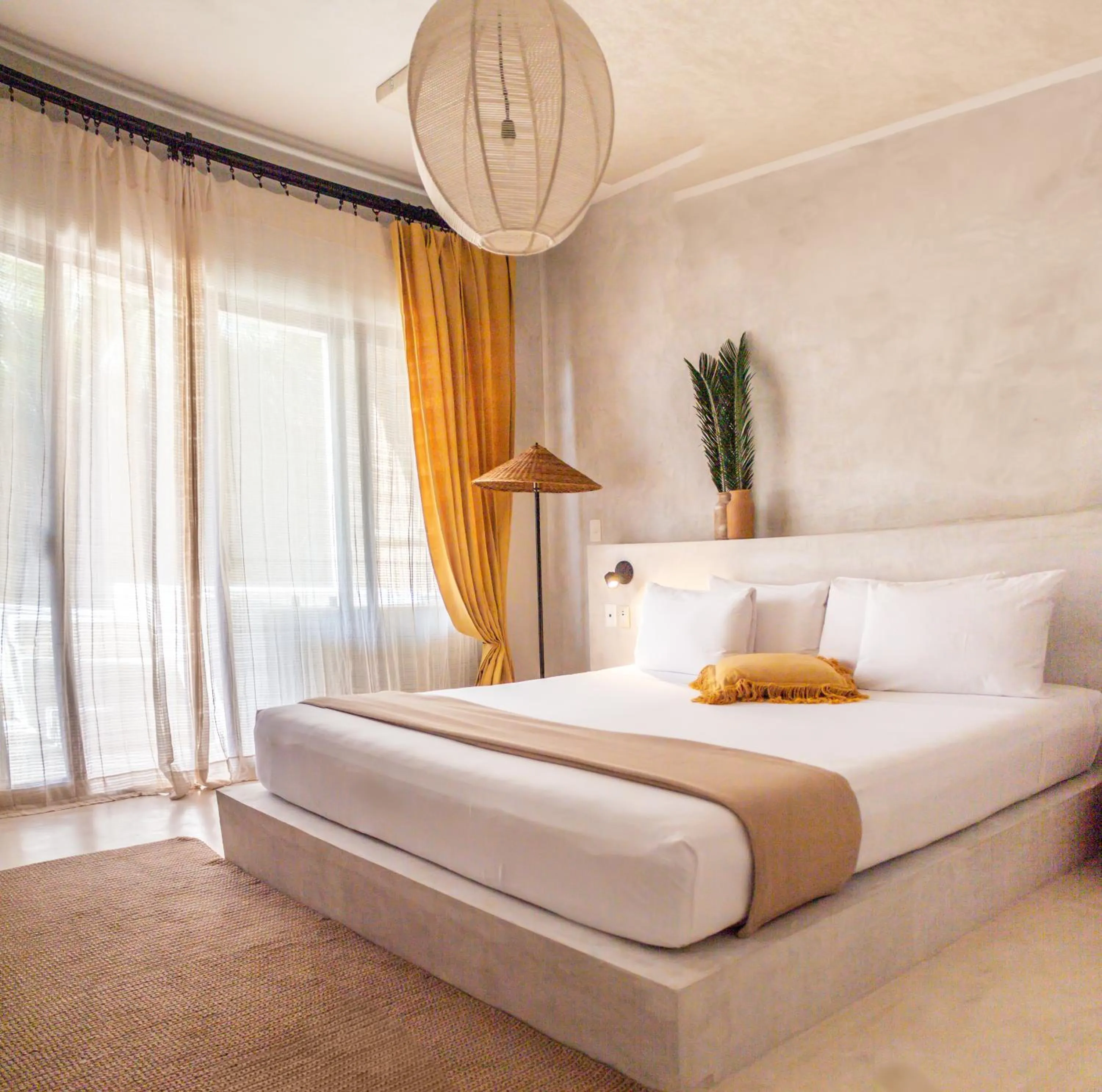 Bed in Dune Boutique Hotel located at the party zone