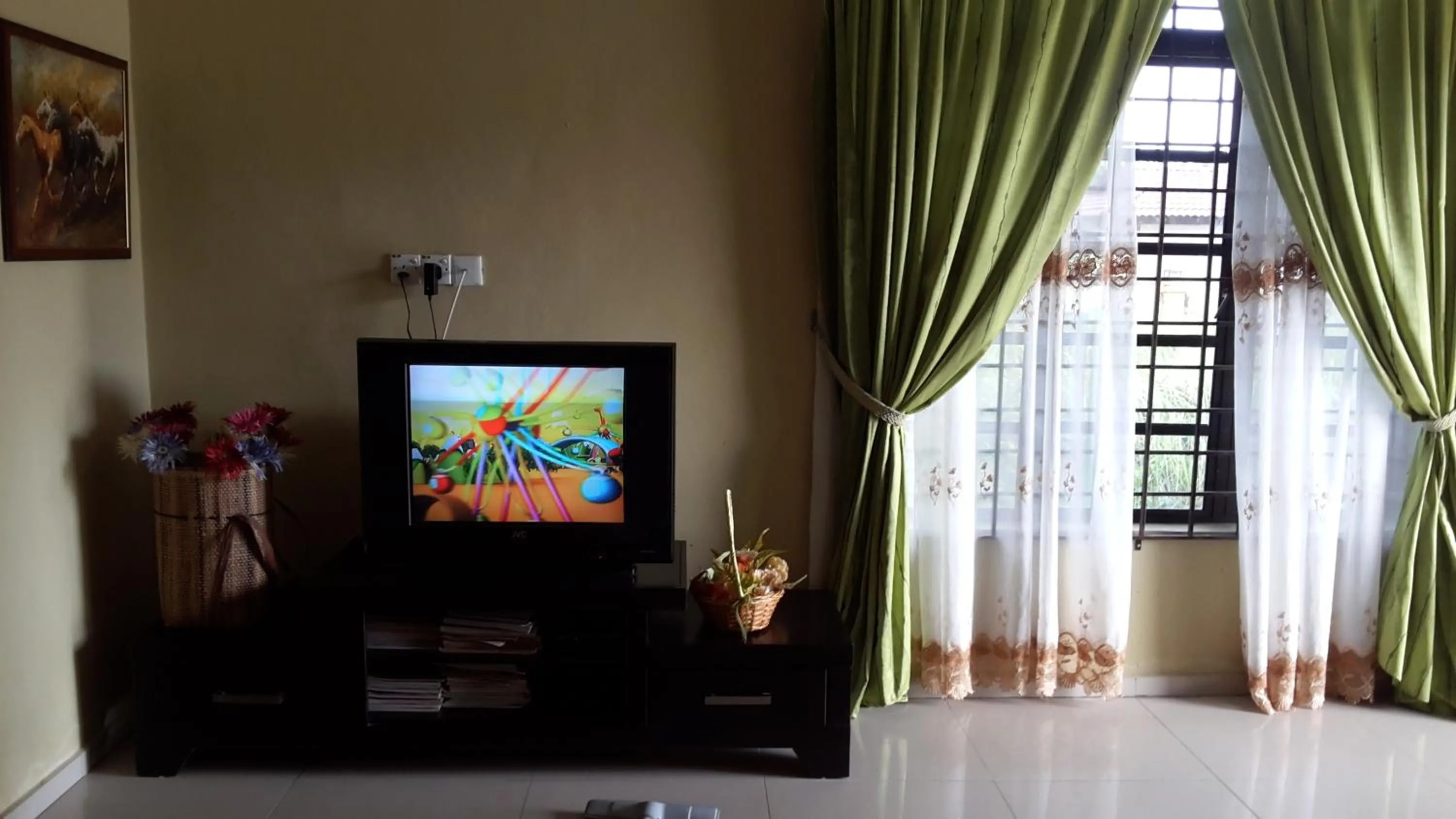 Communal lounge/ TV room in Roemahkoe Holidayhome