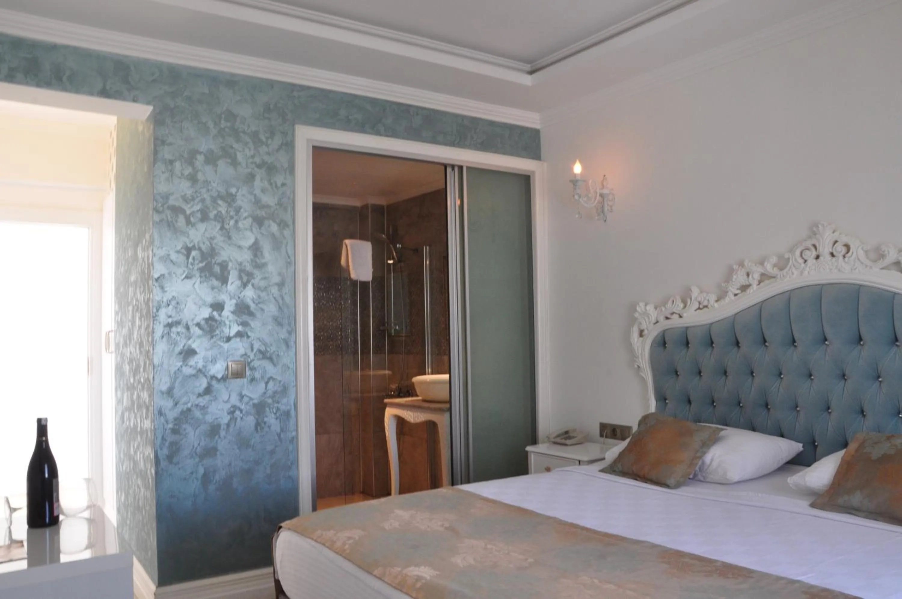 Bedroom in Olivias Group Hotel