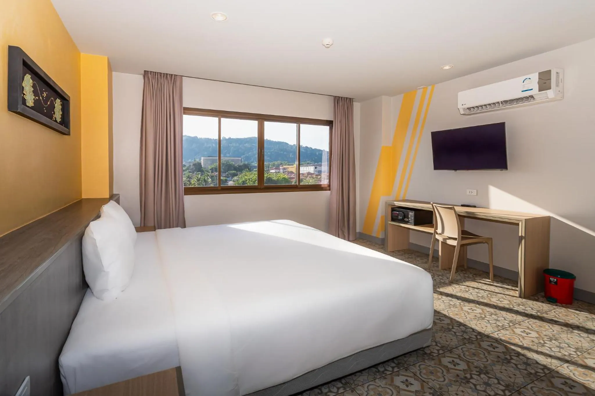 Bed in Recenta Suite Phuket Suanluang