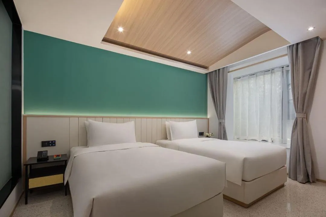 Bed in Wanda Yi, Suite Xishuangbanna
