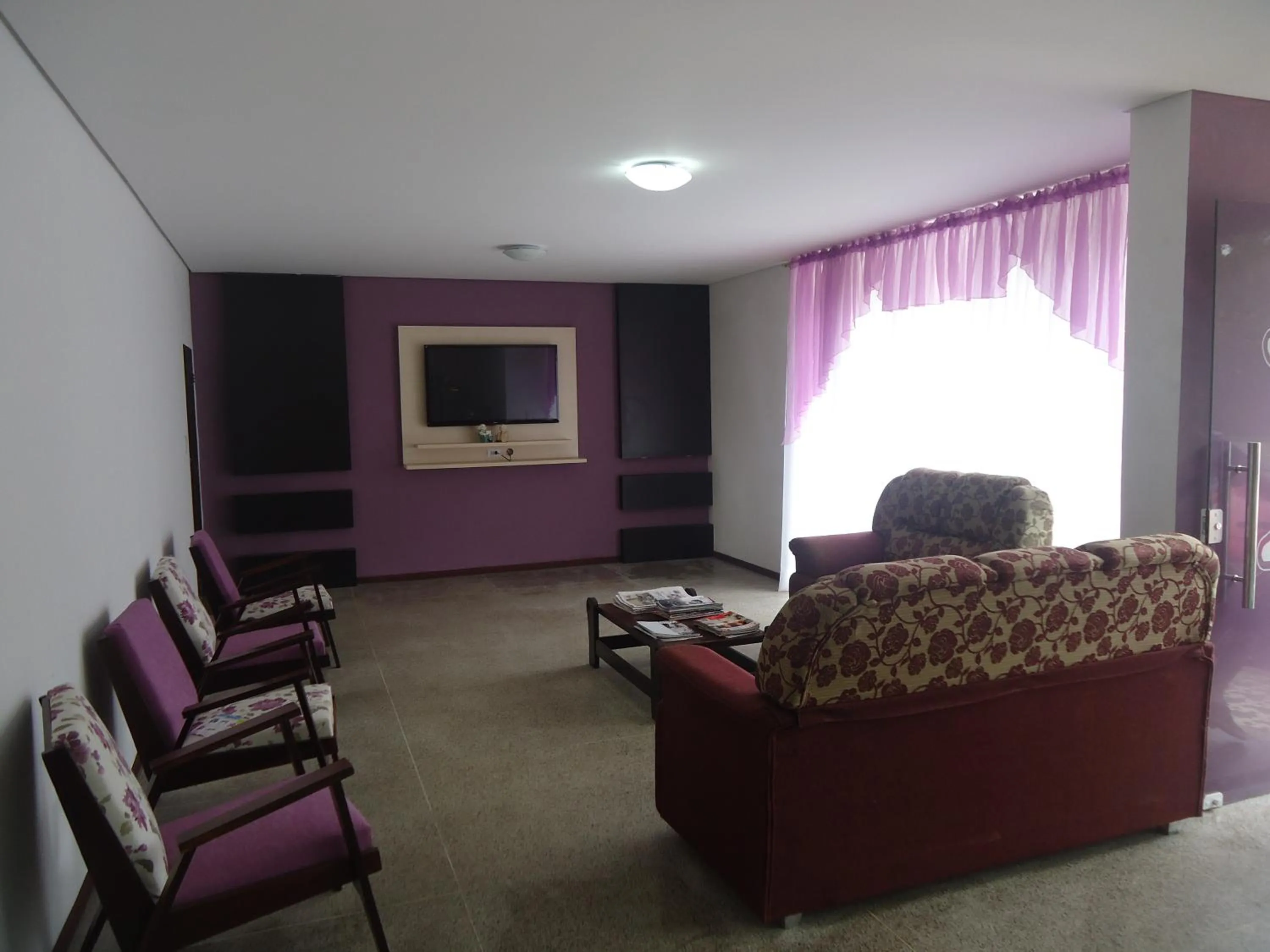 Communal lounge/ TV room in Iria's Hotel