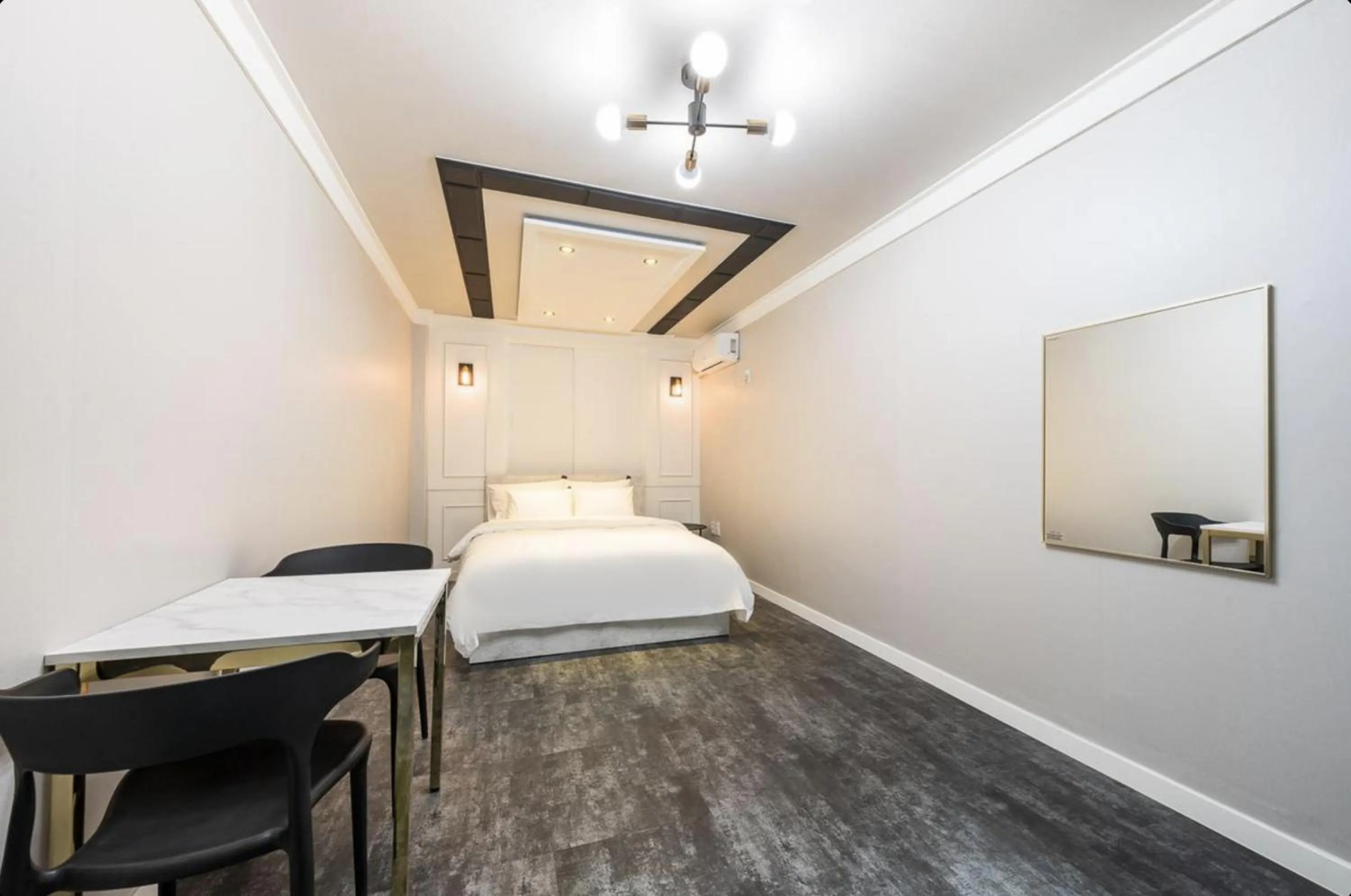 Bed in Gunsan Reborn Hotel