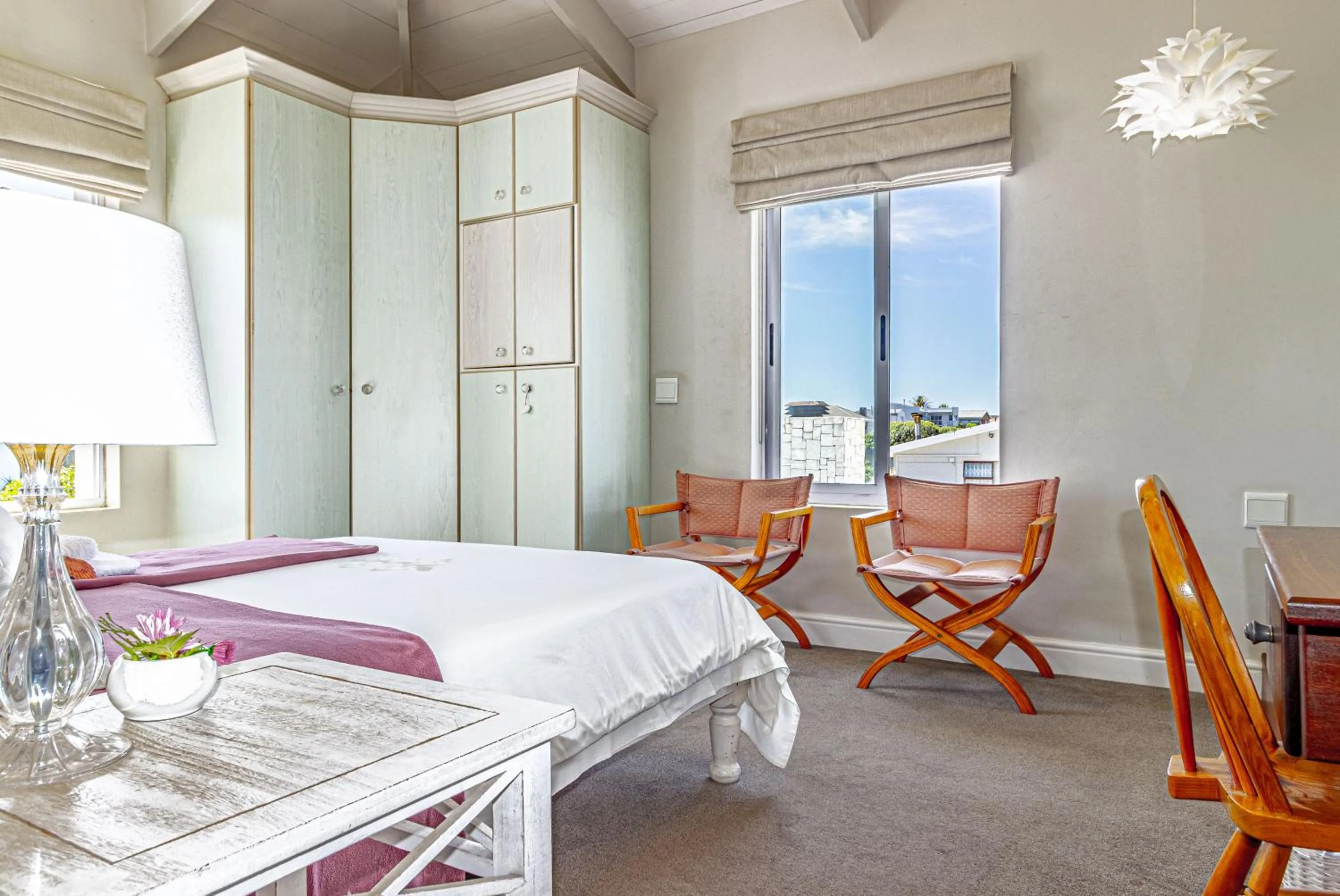 Seating area, Bed in 138 Marine Beachfront Guesthouse