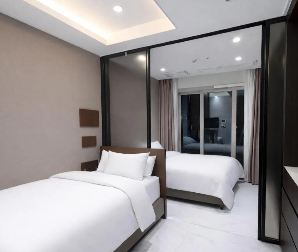 Bed in Magnum Nampo Hotel