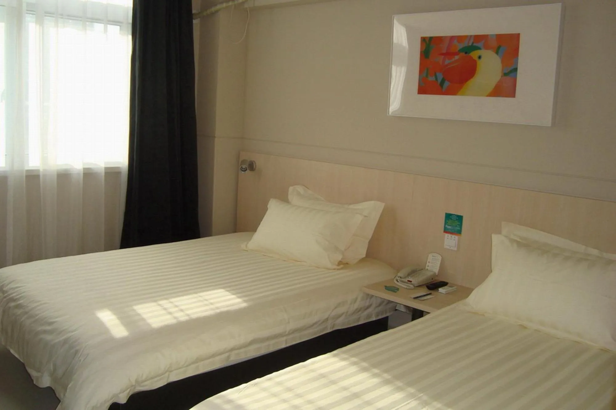 Bed in Jinjiang Inn Wanda Plaza Hotel Taiyuan Street Shenyang