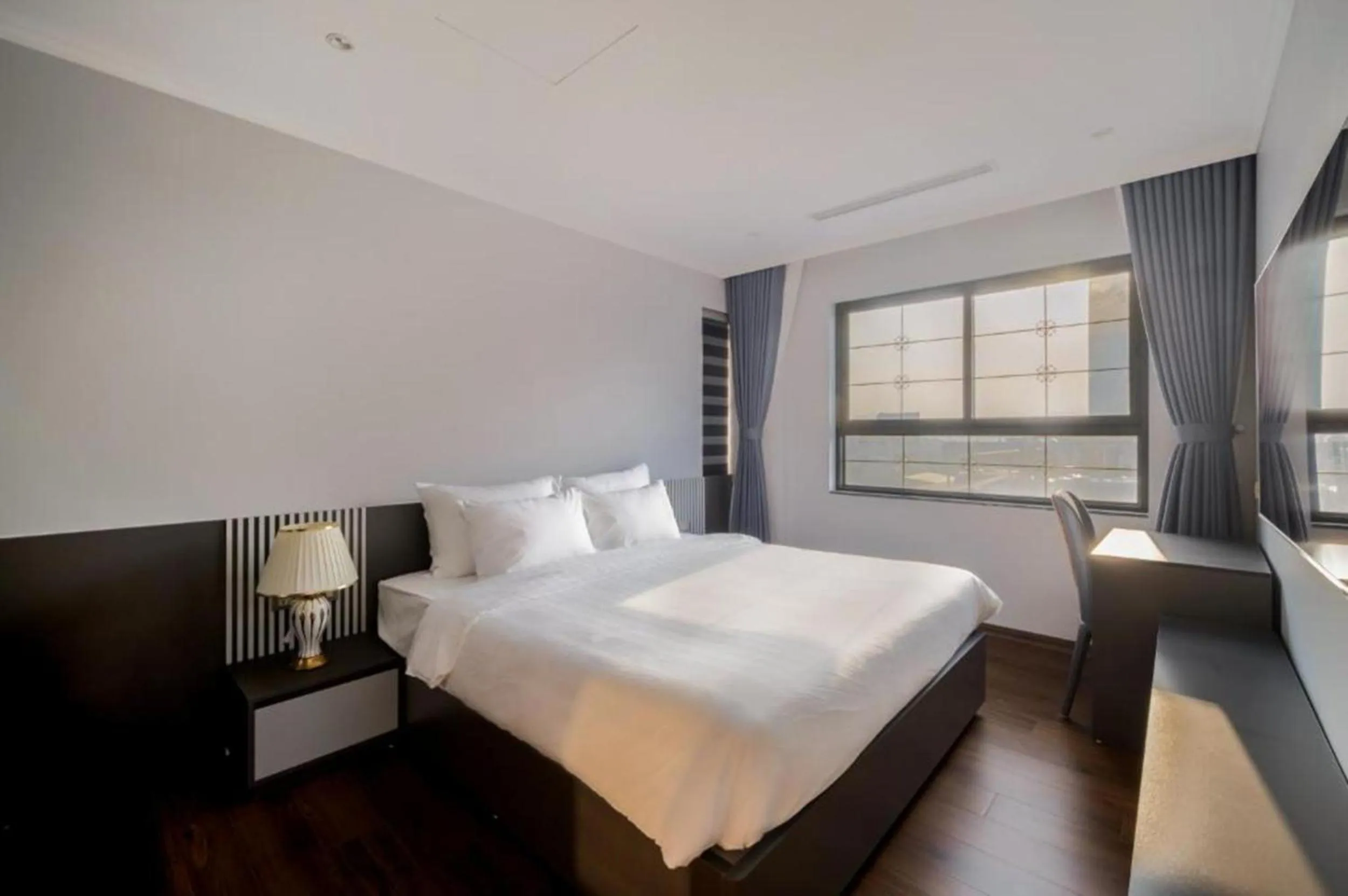 Bed in Luxe Paradise Suites Tay Ho