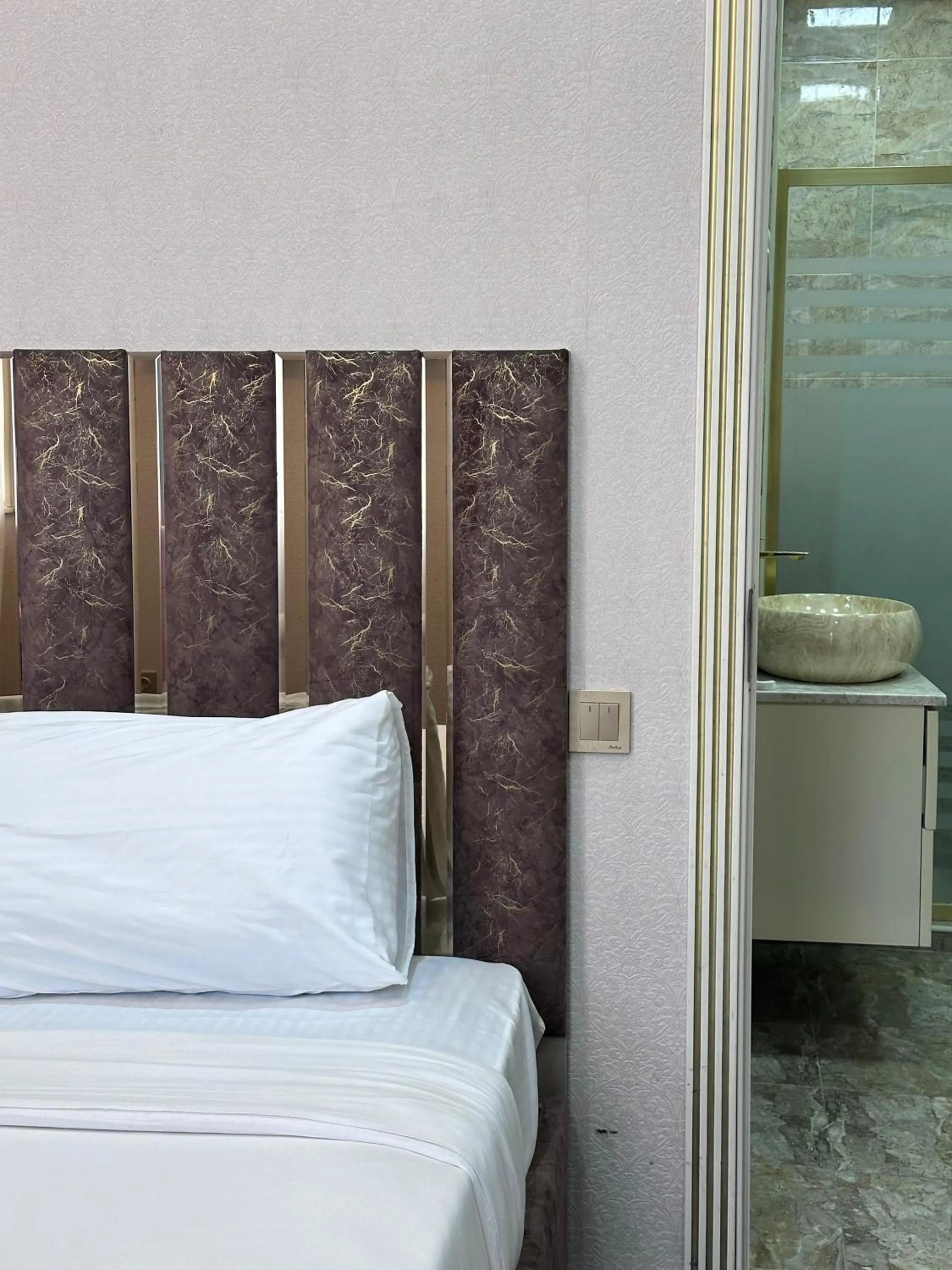 Bed in Central City Hotel