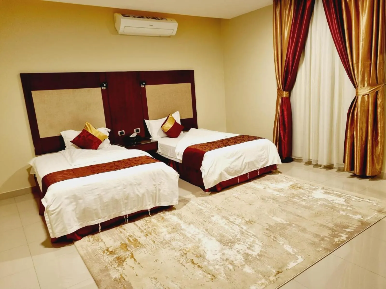 Bed in رؤوم ان للشقق الفندقية-Raoum Inn Hotel Apartments