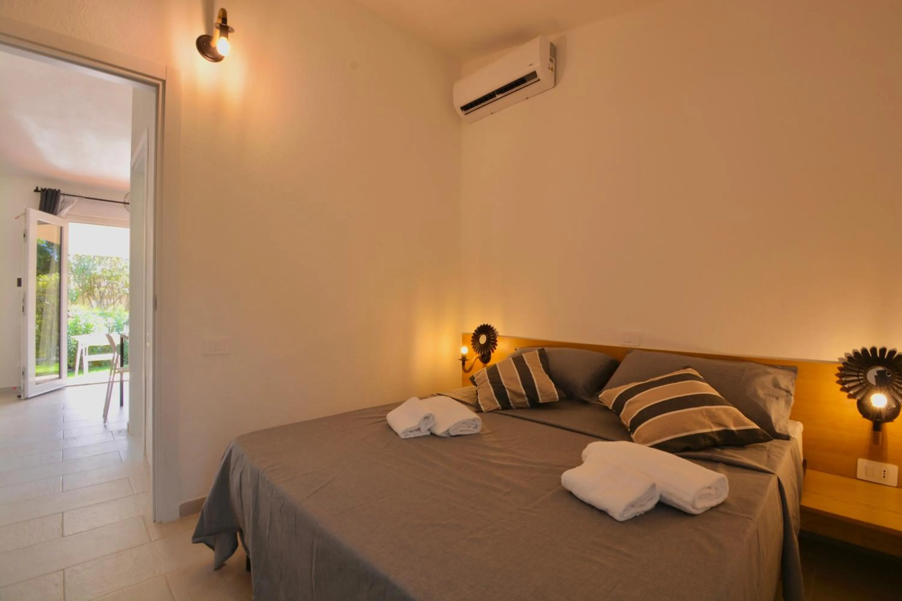 Bedroom, Bed in ISA - Residence in Costa Rei just 450 meters from the beach, apartments with air conditioning and outdoor private area