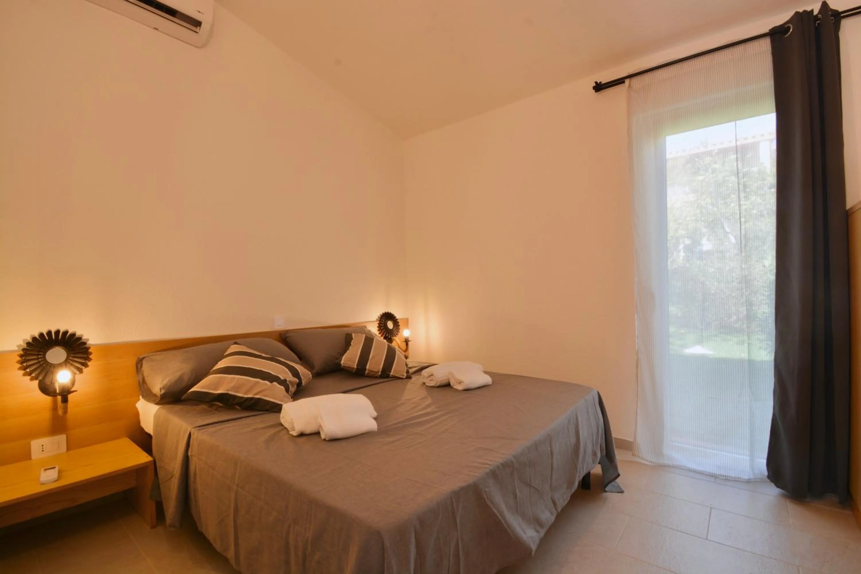 Bedroom, Bed in ISA - Residence in Costa Rei just 450 meters from the beach, apartments with air conditioning and outdoor private area