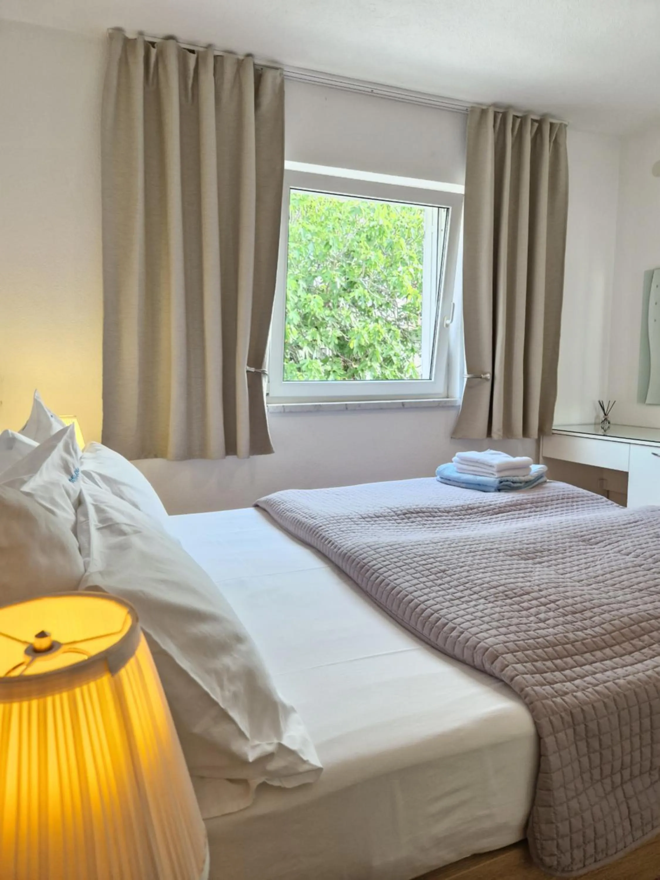 Bed in Apartments Silva with a view of sea