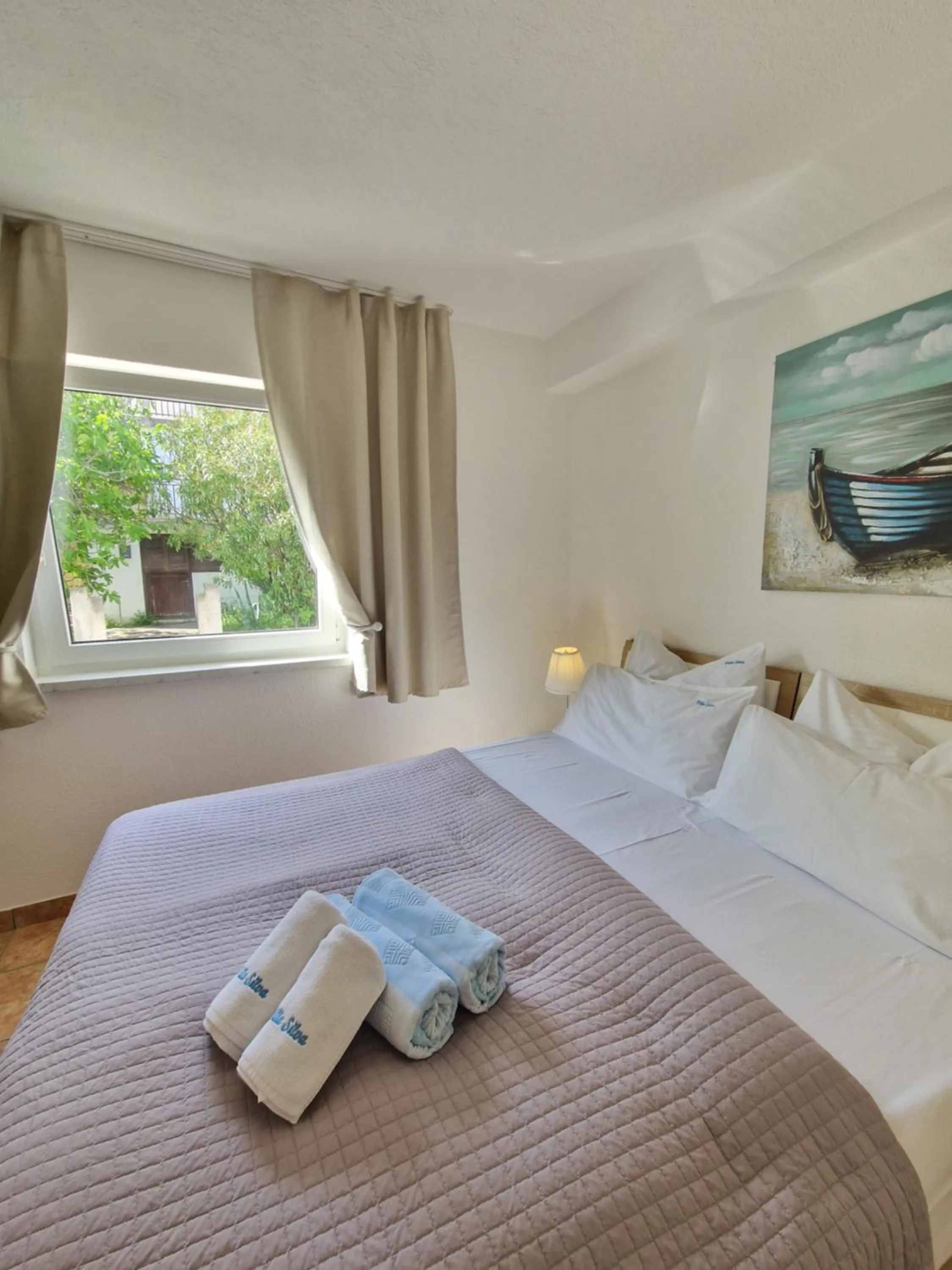 Bed in Apartments Silva with a view of sea