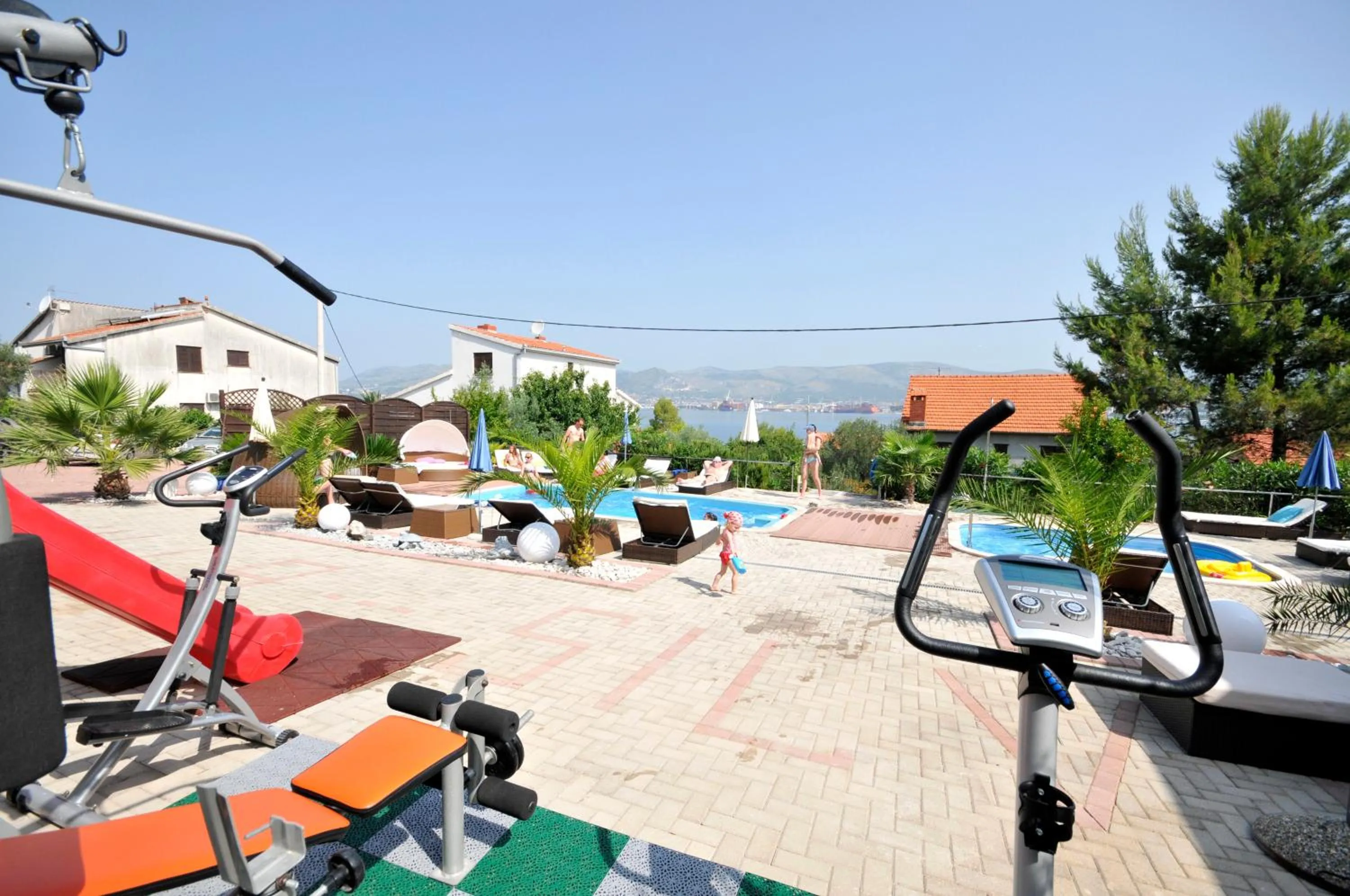 Fitness centre/facilities in Apartments Silva with a view of sea