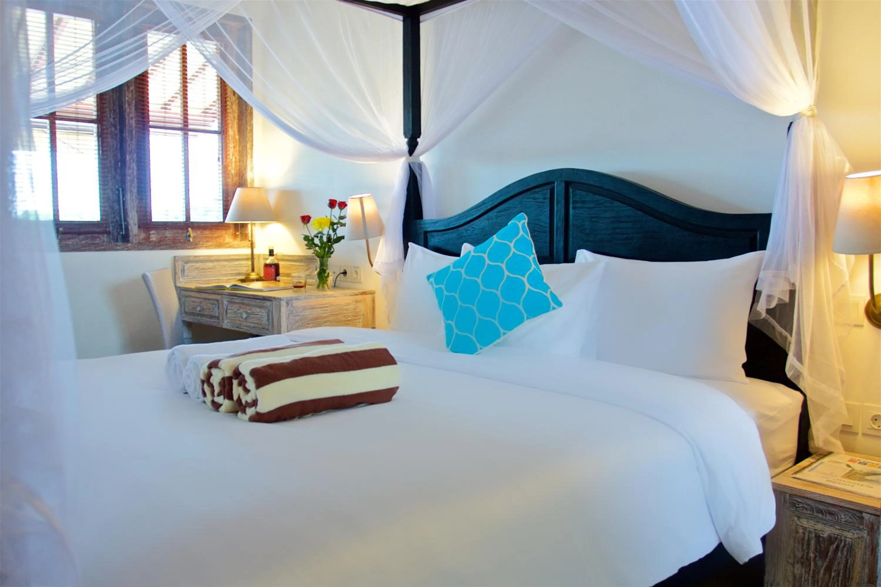 Bed in OK Divers Resort & Spa