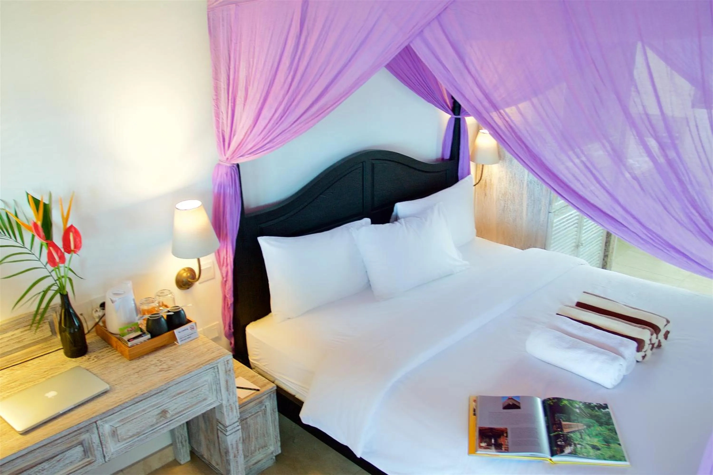 Bed in OK Divers Resort & Spa