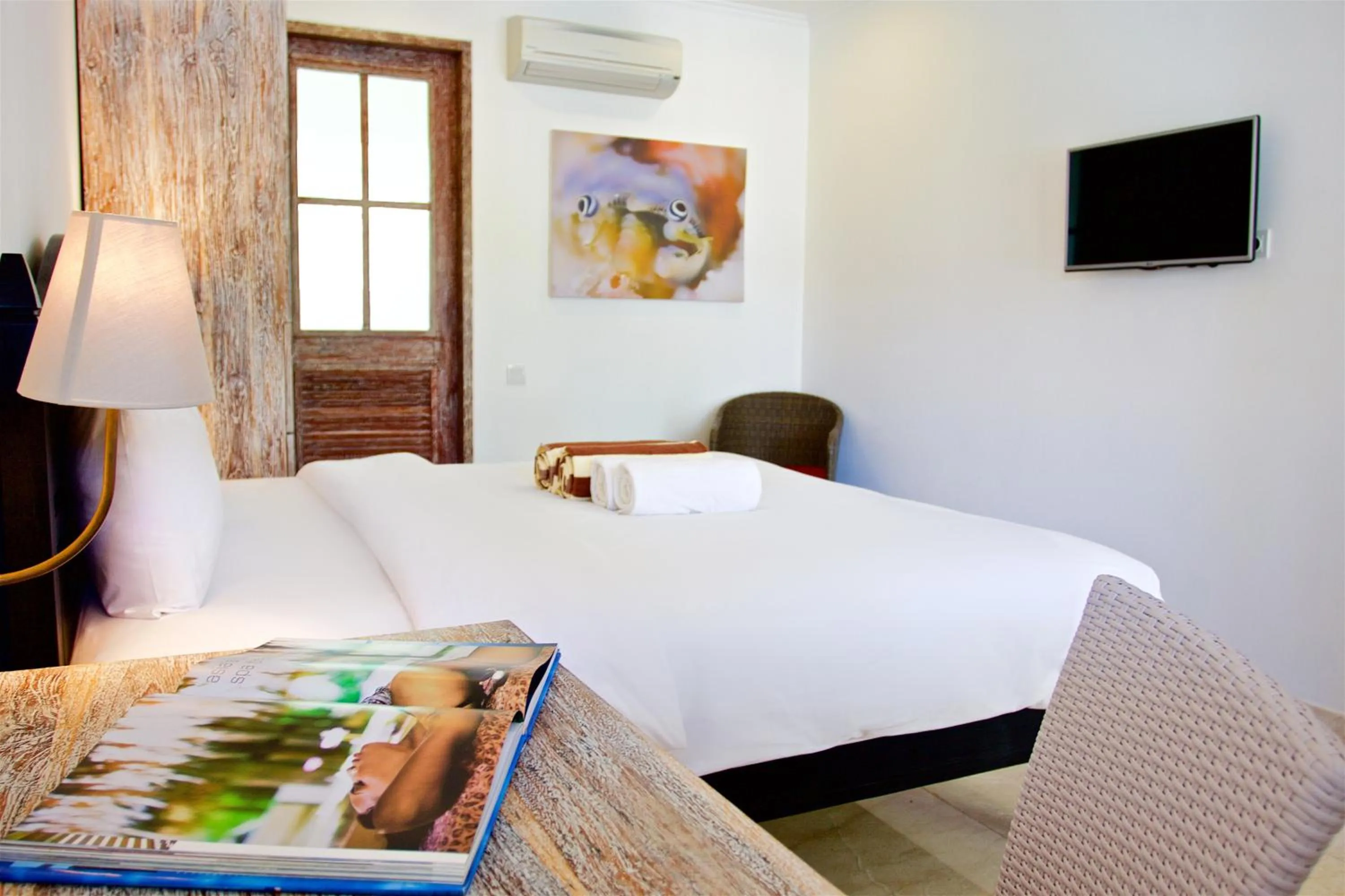 Bed in OK Divers Resort & Spa