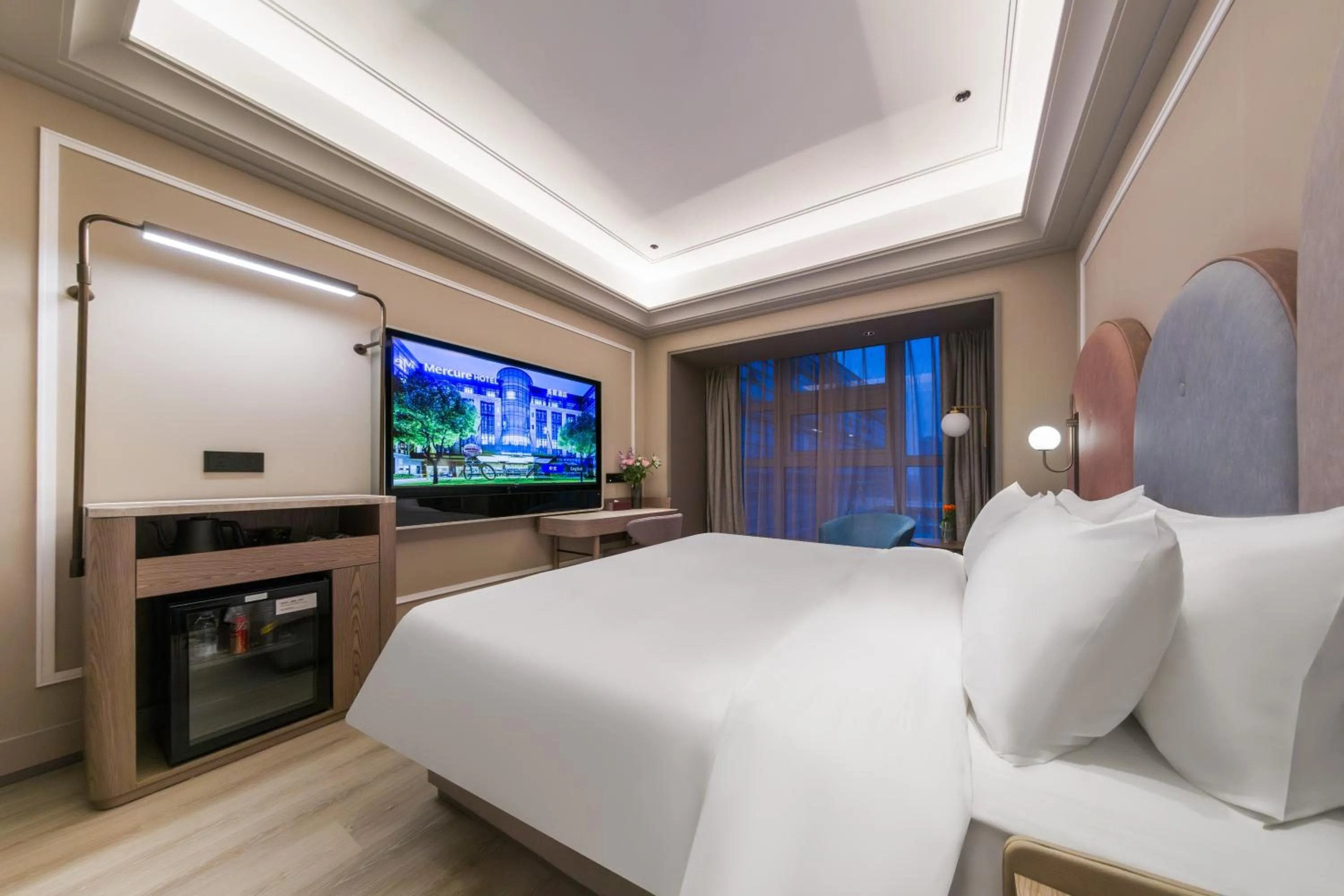 Bed in Mercure Wuxi East Railway Station